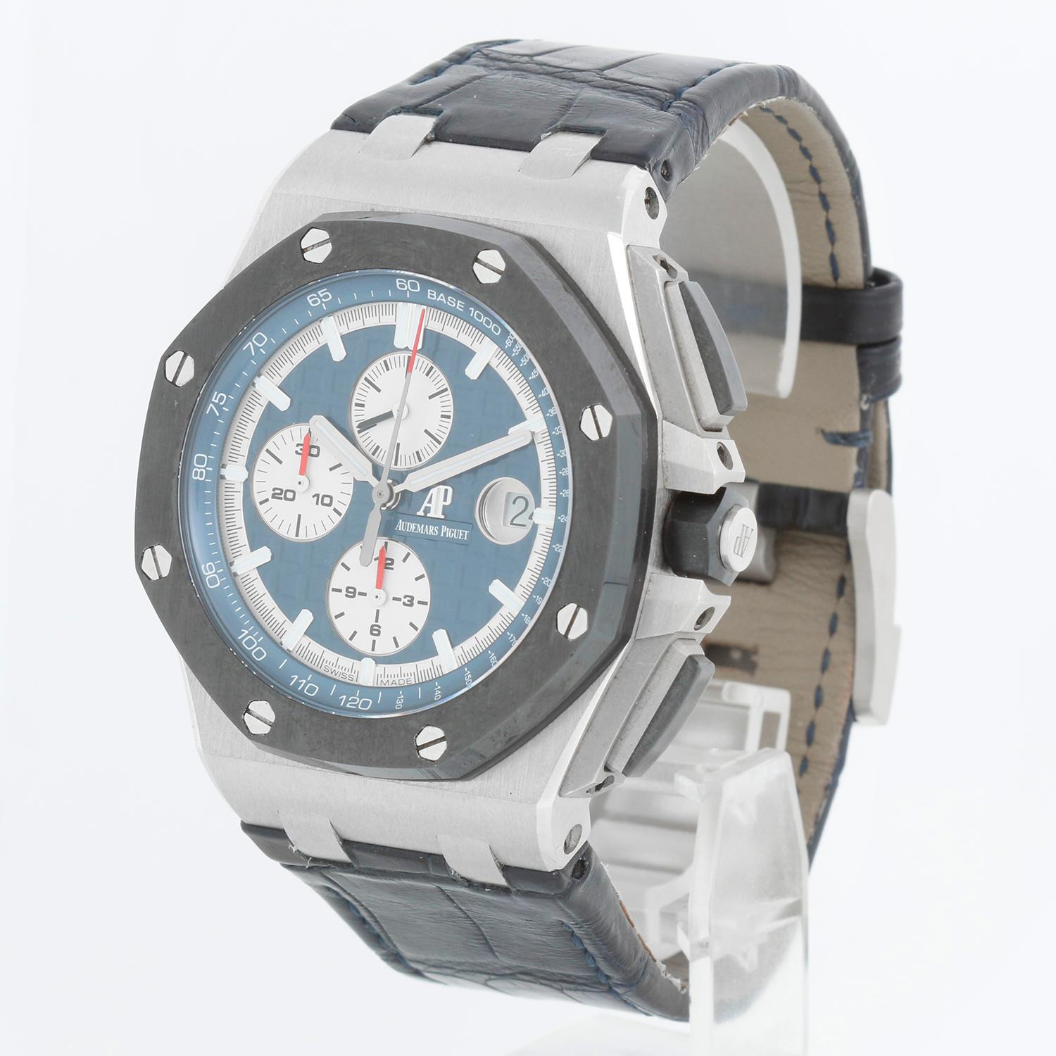 Audemars Piguet Royal Oak Offshore Platinum Men's Watch 26401PO.OO.A018CR.01 - Automatic winding chronograph with date. Platinum (44mm). Glare proofed sapphire crystal and caseback. Blue dial with “Méga Tapisserie”; silver-toned counters, and white