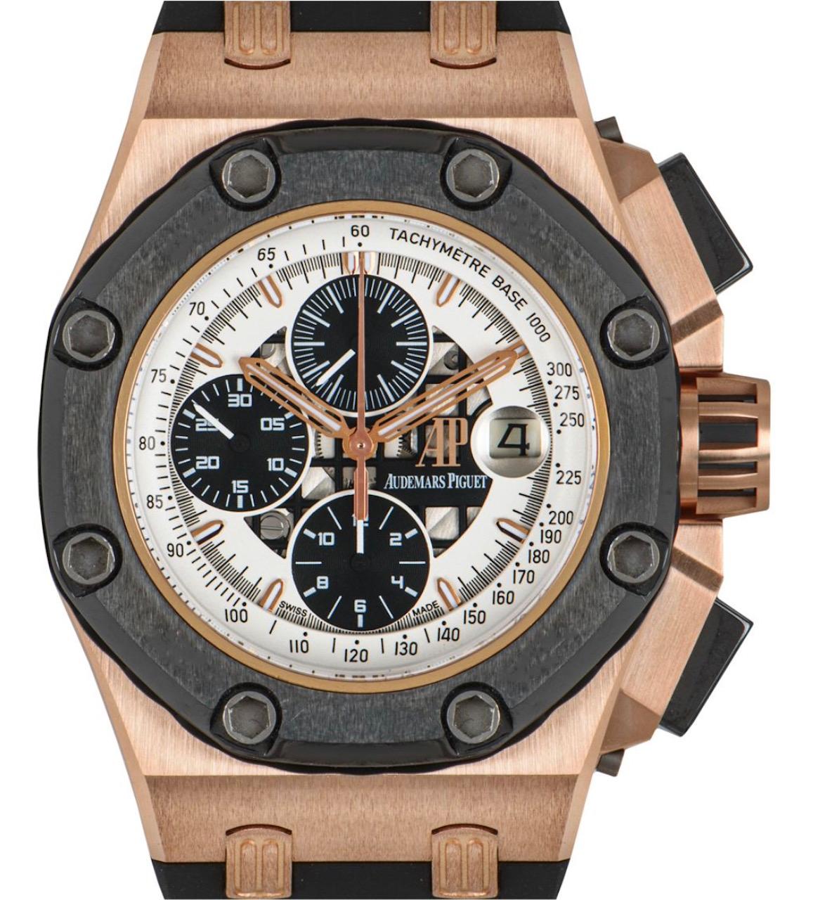 A men's 42mm Royal Oak Offshore Rubens Barrichello ll , crafted in 18k rose gold by Audemars Piguet. Featuring a semi open white dial with 3 black sub dials displaying a 60 second, 30 minute and 12 hour markers. Complementing the dial is a ceramic
