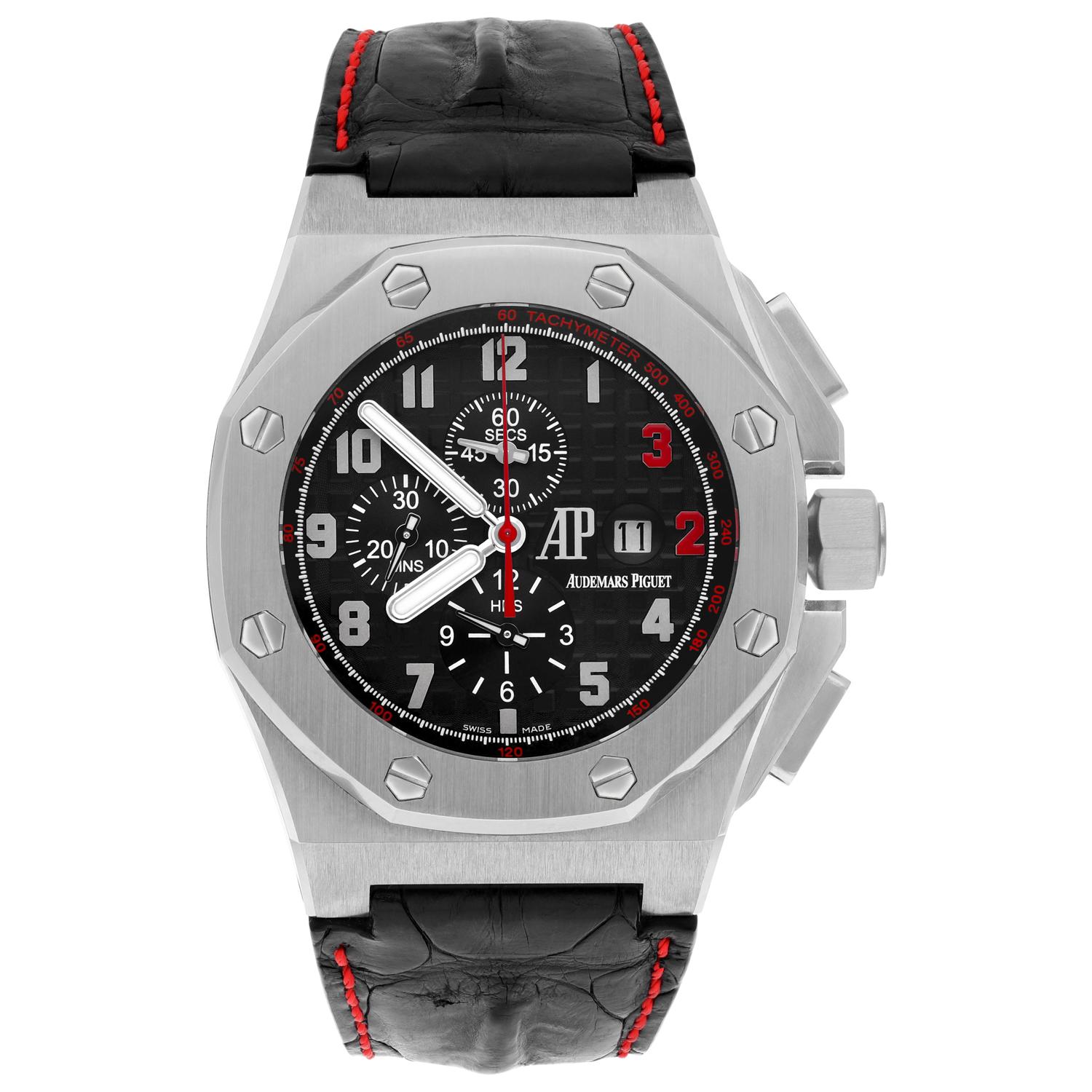 A limited edition 48mm Royal Oak Offshore Shaquille O'Neal wristwatch by Audemars Piguet. Featuring a black dial with arabic numbers, 3 & 2 are coloured in red to reflect the basketball players' jersey number. The watch further features a date