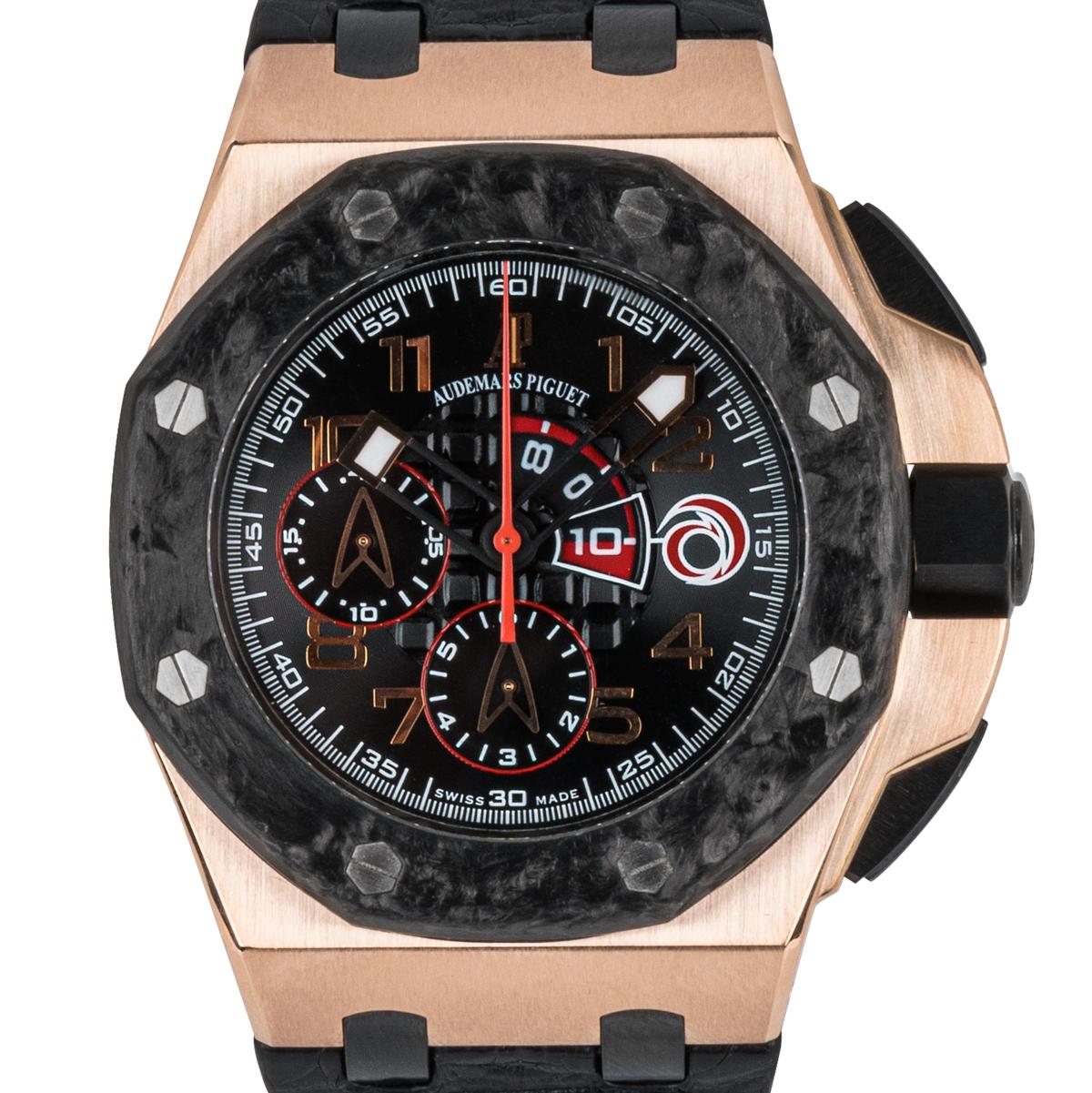 A men's limited edition Royal Oak Offshore Team Alinghi, crafted in rose gold by Audemars Piguet. Features a distinctive black tapisserie design with bold applied arabic numbers. Equipped with a flyback chronograph function and two sub dials