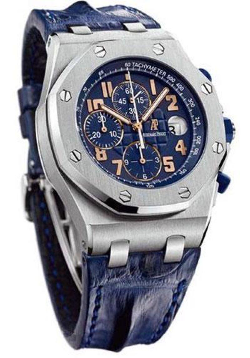 42mm x 14.7mm titanium case, stainless steel bezel, glareproofed sapphire crystal, blue dial with Méga Tapisserie pattern, applied rose gold Arabic numerals, automatic-winding Audemars Piguet Calibre 2326/2840 movement with chronograph, date, and