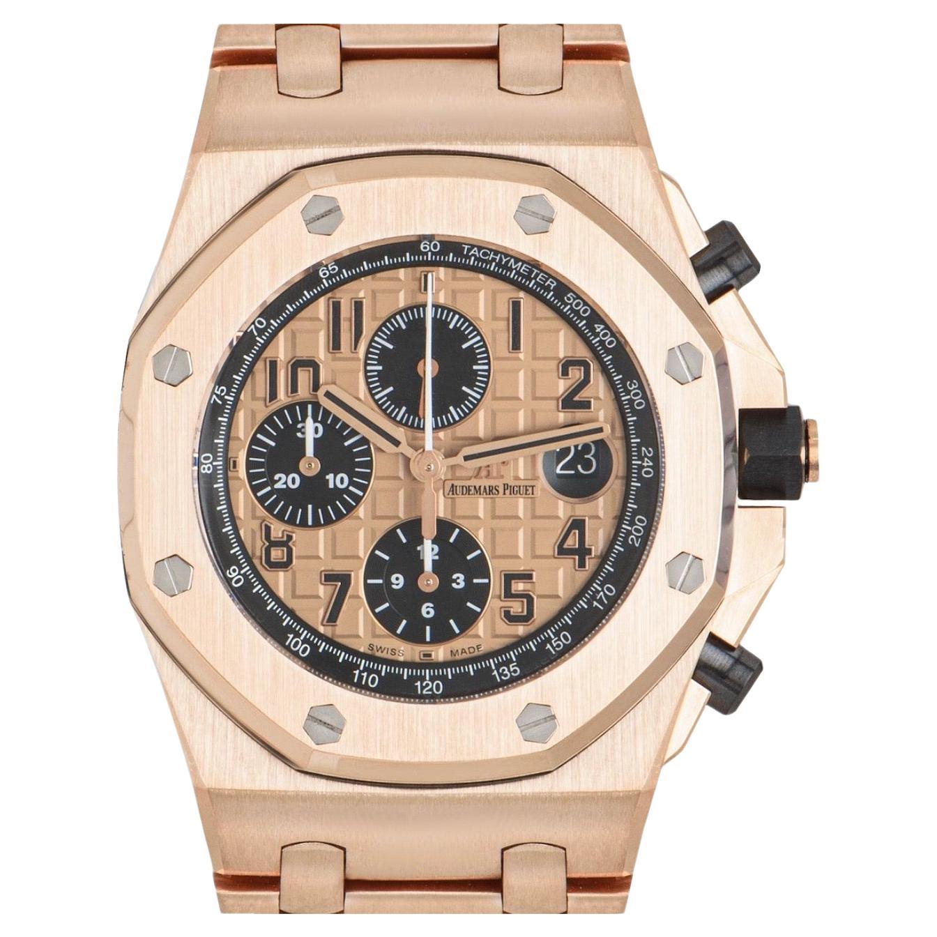 A stunning mens Royal Oak Offshore wristwatch crafted in 18k rose gold by Audemars Piguet. Features a pink-toned dial with Méga Tapisserie pattern, 3 black counters featuring a 12 hour recorder, 30 minutes recorder, a small seconds and a date