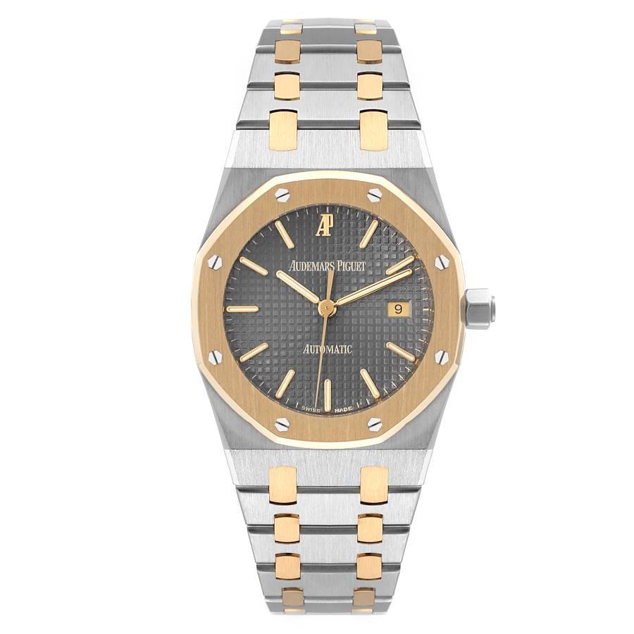Audemars Piguet Royal Oak Steel Yellow Gold Mens Watch 15000SA. Automatic self-winding movement. Stainless steel case 33.0 mm in diameter. 18k yellow gold bezel punctuated with 8 signature screws. Scratch resistant sapphire crystal. Grey Tapisserie