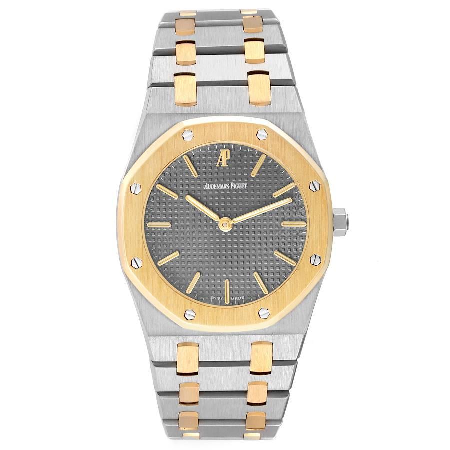 Audemars Piguet Royal Oak Steel Yellow Gold Mens Watch 56303. Quartz movement. Stainless steel case 33.0 mm in diameter. 18k yellow gold bezel punctuated with 8 signature screws. Scratch resistant sapphire crystal. Grey Tapisserie (waffle pattern)