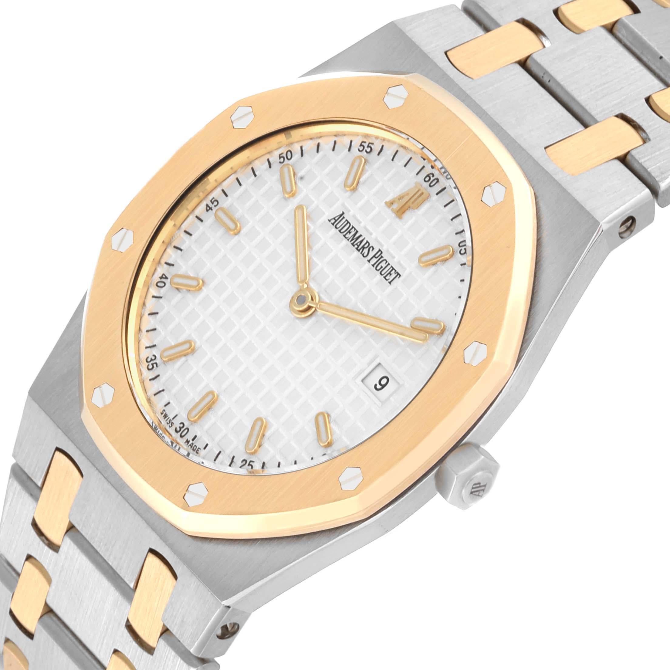 Audemars Piguet Royal Oak Steel Yellow Gold Mens Watch 57175SA Papers. Quartz movement. Stainless steel and 18K yellow gold case 33.0 mm in diameter. 18K yellow gold bezel punctuated with 8 signature screws. Scratch resistant sapphire crystal. White