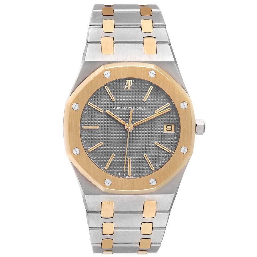 Audemars Piguet Royal Oak Steel Yellow Gold Mens Watch 6023SA Box Papers. Quartz movement. Stainless steel and 18K yellow gold case 36.0 mm in diameter. 18K yellow gold bezel punctuated with 8 signature screws. Scratch resistant sapphire crystal.