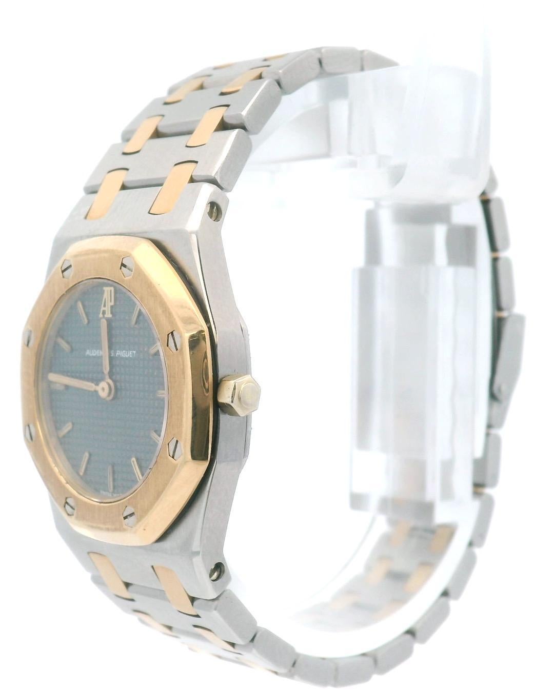 Audemars Piguet Royal Oak Ladies Watch. 26mm stainless steel case. 18K yellow gold octagon bezel. Gray tapestry dial with gold tone hands and index hour marker. 18K yellow gold & stainless steel bracelet with fold over the clasp with safety. Will