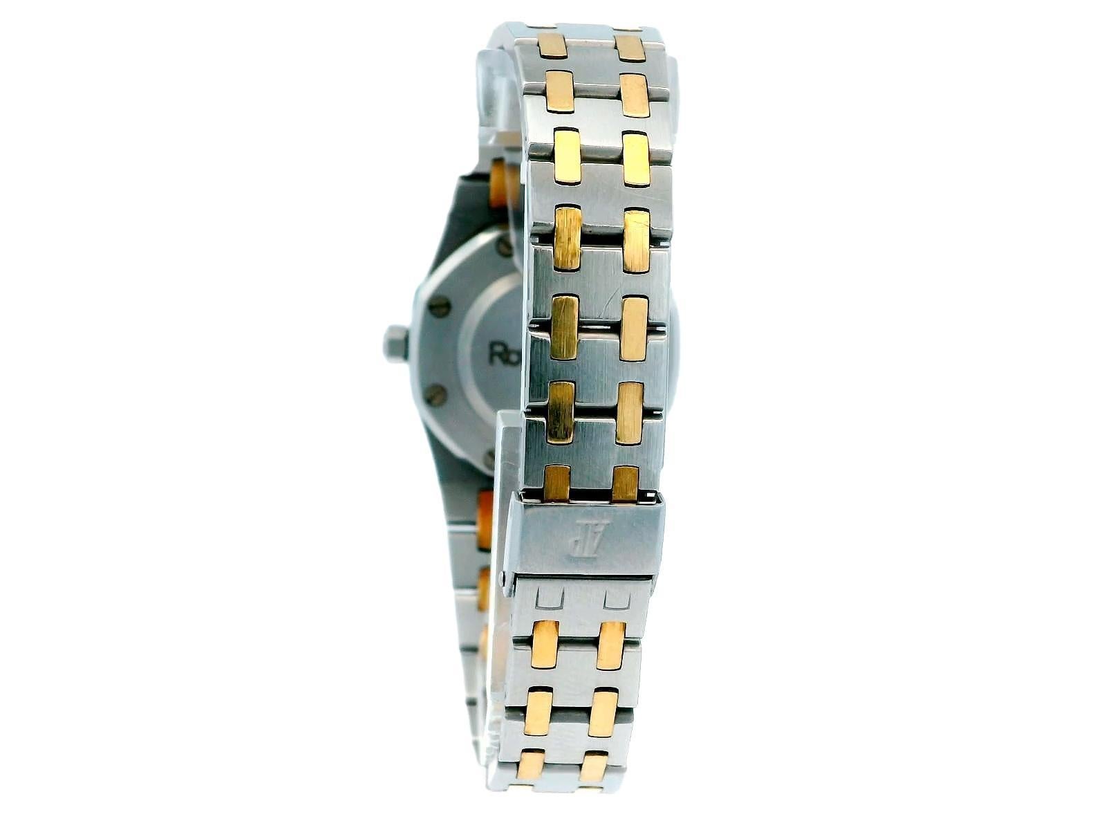 The Audemars Piguet Royal Oak Ladies' Watch is an elegant timepiece that combines luxury and functionality. It features a 29mm stainless steel case, which provides a sturdy yet refined look. The striking octagonal bezel is made of 18K yellow gold,