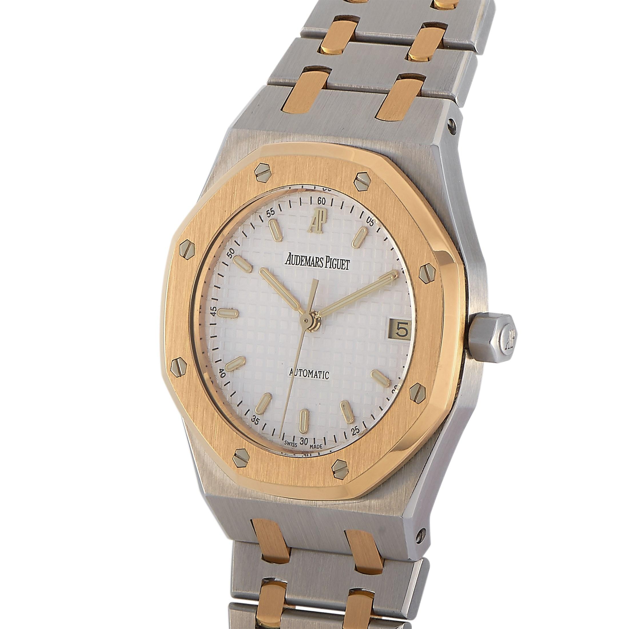 This Royal Oak Mid Size is a legend. It bears the classic Genta design. This watch has a 36mm two-toned case fashioned from stainless steel and topped with an 18K yellow gold octagonal bezel with hexagonal bolts. This impressive watch with a