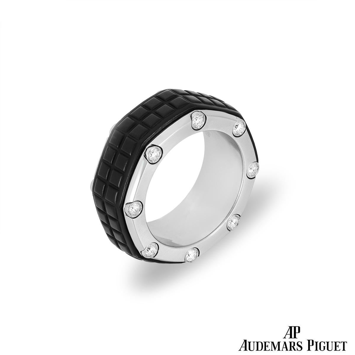 A statement titanium and diamond ring by Audemars Piguet from the Royal Oak Offshore collection. The ring is of an octagonal design set through the middle with a patterned rubber inlay and satin-finished outer edges. Both sides are set with 8 round