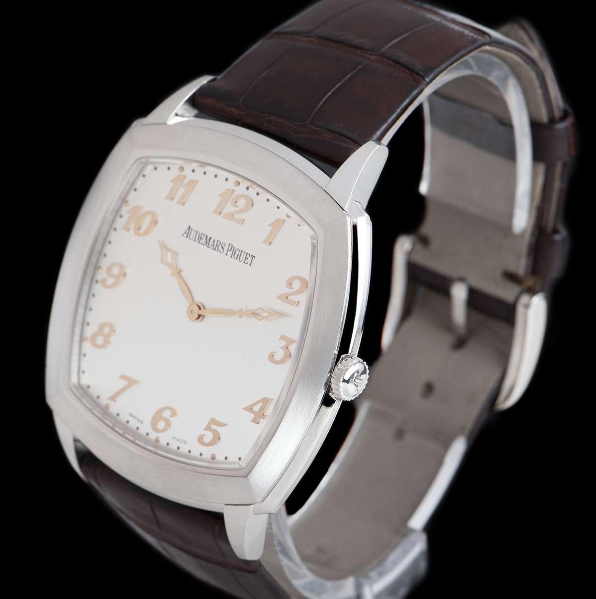A Platinum Tradition Extra-Thin Gents Wristwatch, silver-toned opaline dial with applied arabic numbers, a fixed platinum bezel, an original dark brown leather strap with an original platinum pin buckle, sapphire glass, exhibition caseback,