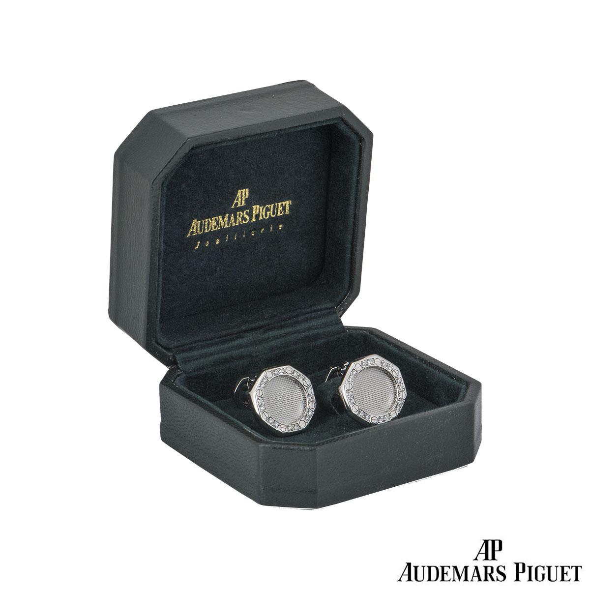 An 18k pair of white gold diamond cufflinks by Audermars Piguet from the Royal Oak collection. The cufflinks feature a waffle design centre, set with the iconic Audemars Piguet screws and 16 round brilliant cut diamonds on each cufflink. The