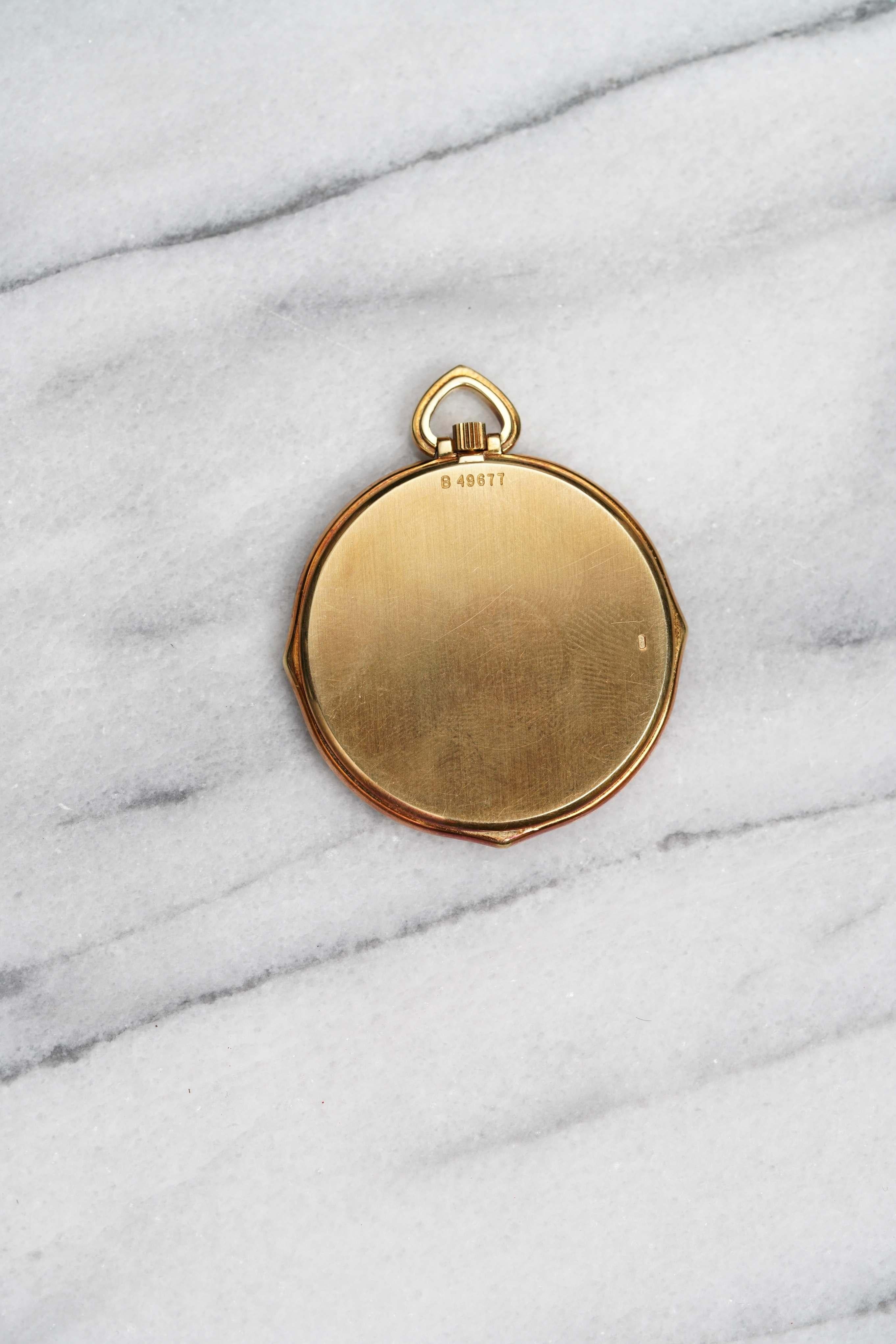 Here’s a Audemars pocket watch in 18K yellow gold with a white roman numeral dial from the 1980s. Roundish octagonal shape. Dauphine hands. No 5689. Movement number 227436. Caliber 5020. Comes with its box, wallet, original papers, and pamphlets.