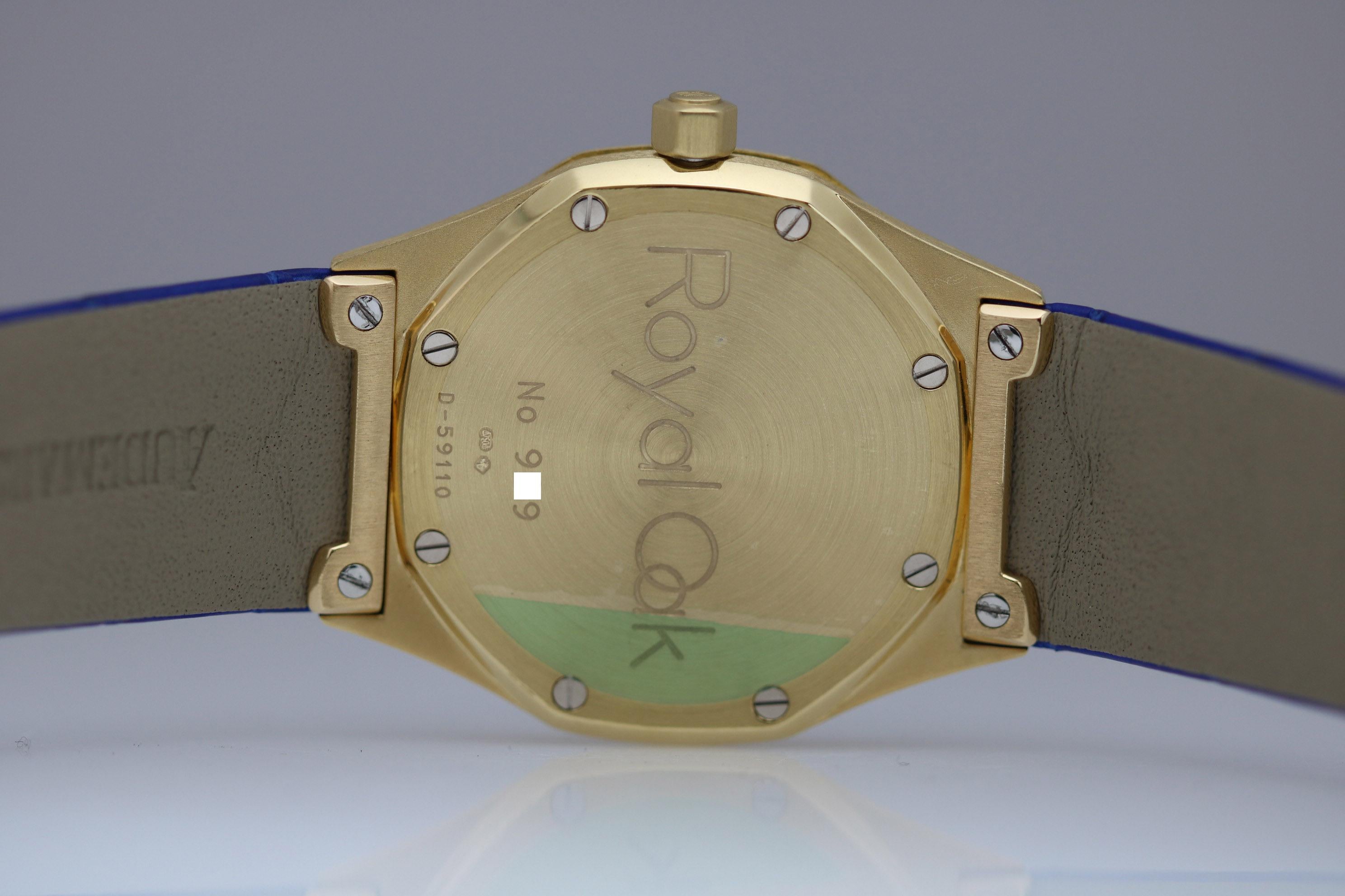Audemars Piguet Royal Oak Ref 14800 in yellow gold, has an automatic movement,  the Guillouche dial has a date feature and is on a new royal blue Audemars Piguet strap with a deployant clasp.   Comes with Audemars Piguet Service Card. circa 1997