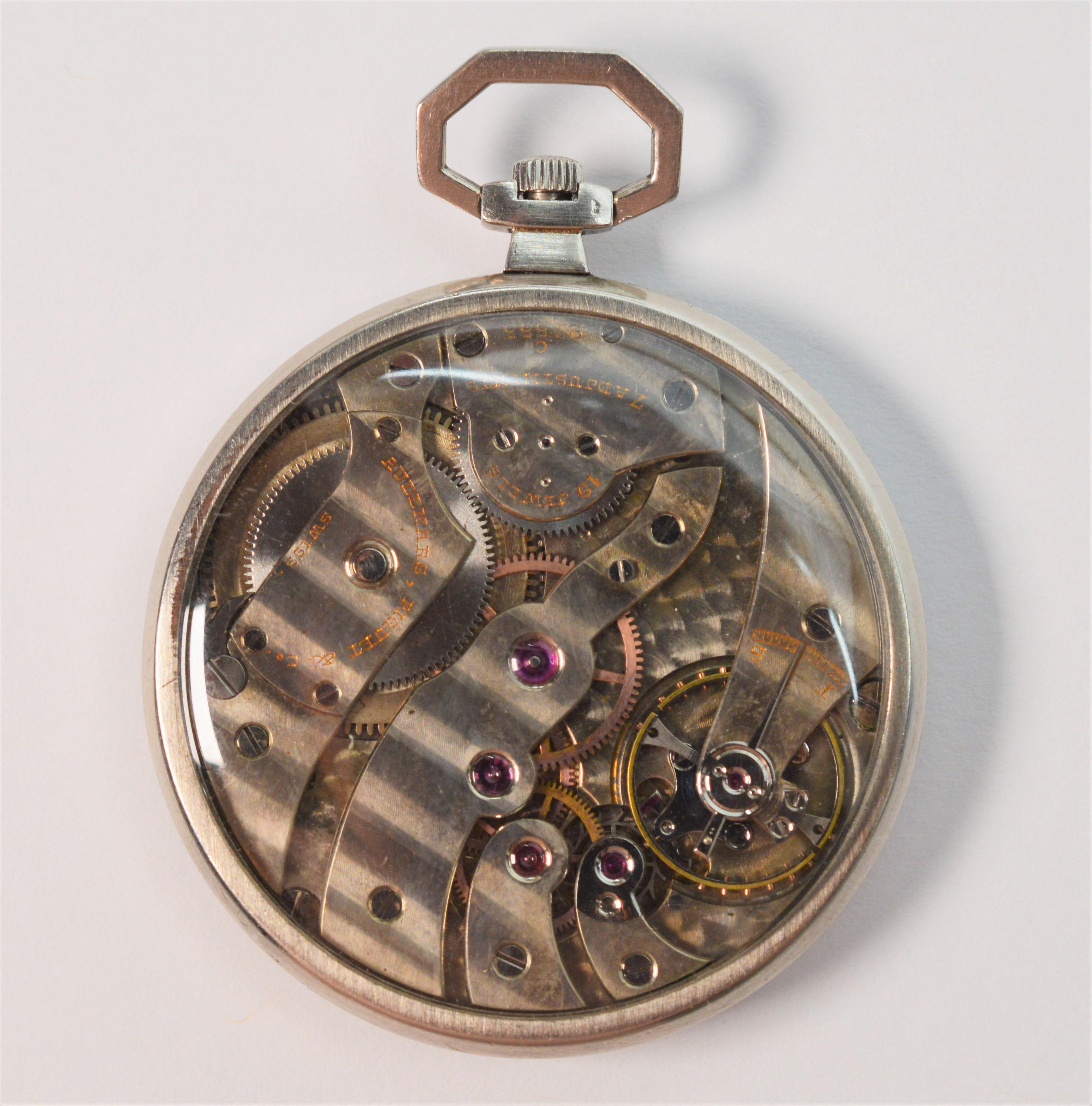 Sleek, late twentieth century platinum pocket watch by Audemars Piquet Swiss for Tiffany & Co. with special order glass display back to view its intricate nineteen jewels seven adjustment movement in motion. In watch size is 41mm (approximately 1