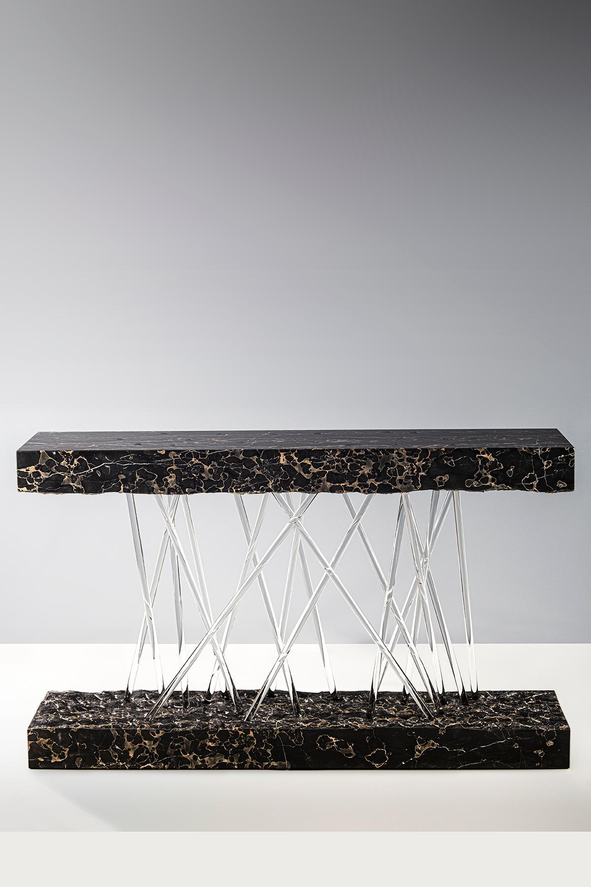 Rectangular console composed of one black Portoro marble block with gold and grey veining marble block separated into two parts, the top is supported only by criss-crossing Borosilicate glass rods below which are set into the bottom part.
Model