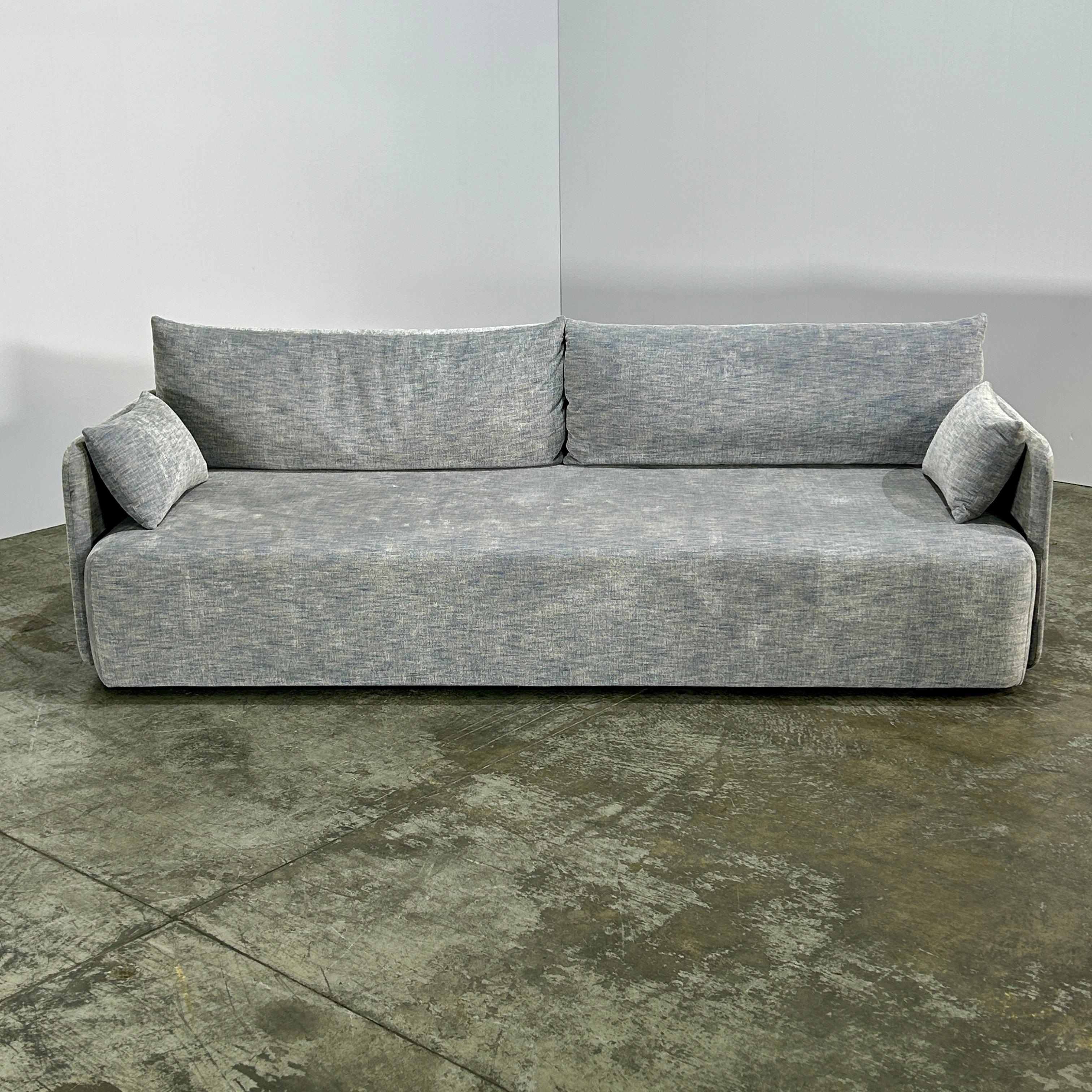 Introducing the Audo Copenhagen Offset Three Seater Sofa, designed by the renowned Norm Architects. This stunning piece features a sleek and modern design, perfect for any contemporary living space. Crafted with the highest quality materials, this