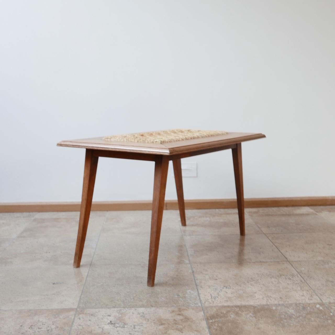 A coffee table by Audoux et Minet. 

By French duo Adrien Audoux and Frida Minet for Vibo, circa 1940s.

Woven hemp natural ropework combined with a blond wood makes for a timeless classic.

The ropework insert can be removed.
 