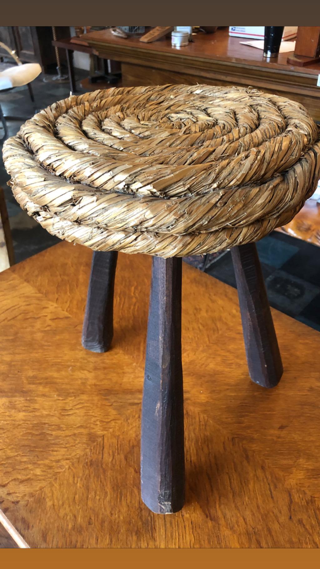 This is a lovely midcentury braided rush stool by French designers Adrien Audoux and Frida Minet.