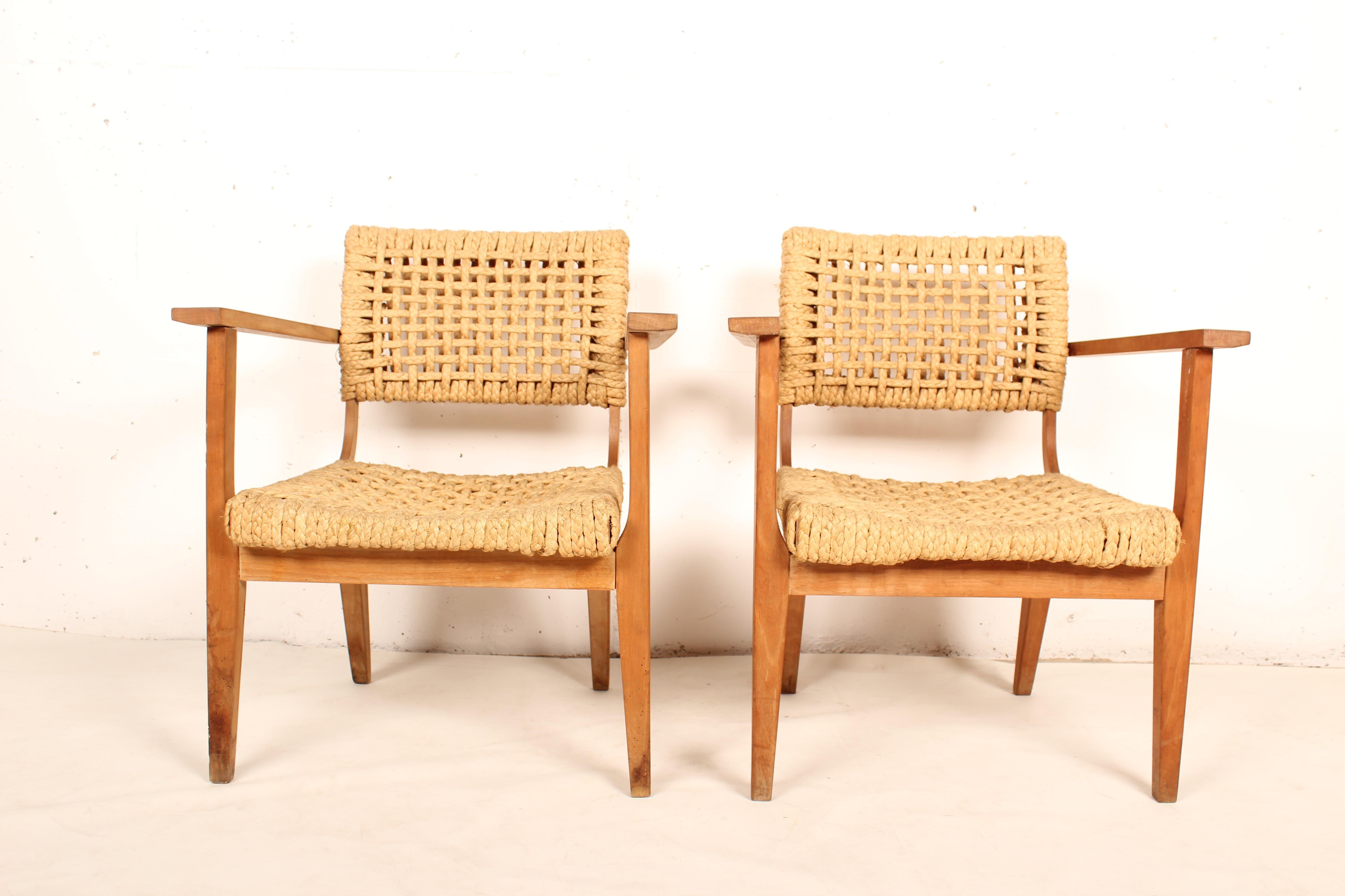 Robust French armchair from the beginning of the 50's. The seat and the back are made of woven hemp from the abaca plant. This natural style is typical for the French design of Audoux-Minet established in Marseille.
 
