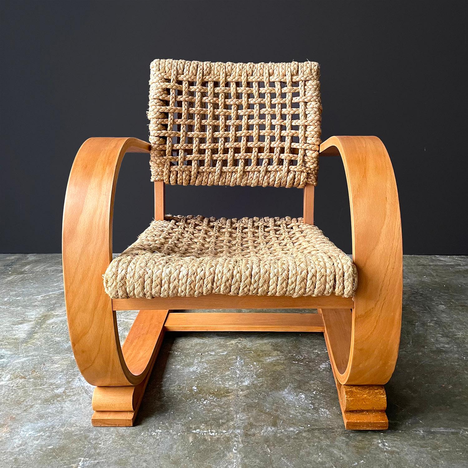 Adrien Audoux & Frida Minet low slung rope chairs
France, circa 1950’s
Bentwood cantilevered frames with braided rope seats and back rests
Sold as a pair
Wear consistent with age and use. 
Wood in good vintage condition with minor imperfections
