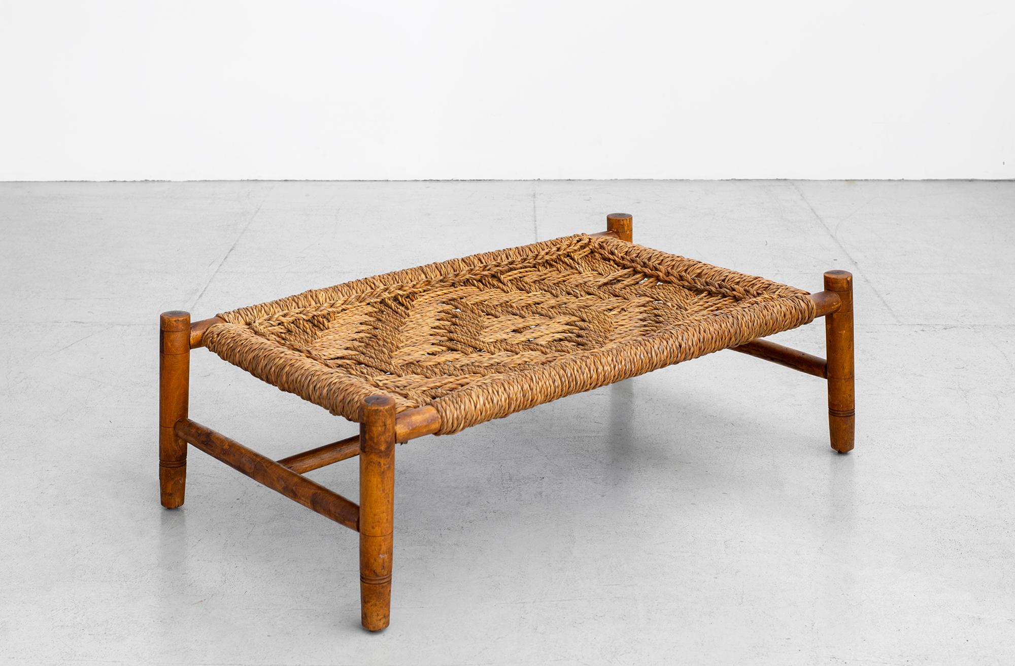 Audoux Minet coffee table with woven rope top
Could be used as a coffee table or ottoman table 
Great patina to oakwood and rope top. 

  