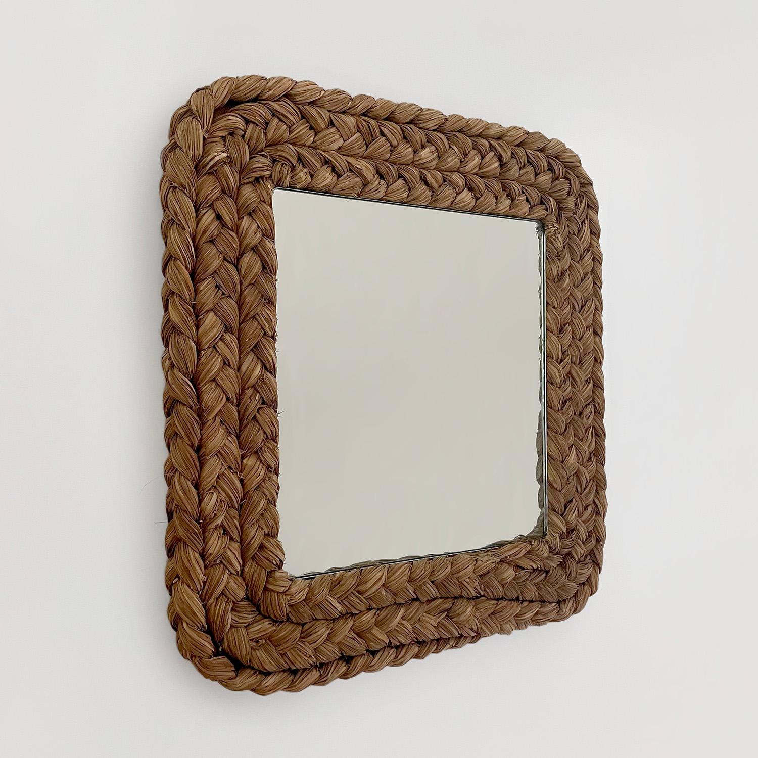 Audoux Minet coiled rope wall mirror
France, circa 1950’s
Coiled mirror frame is comprised of braided sea grass rope
Organic texture and feel
Natural color variations
Patina from age and use


We have a large collection of Audoux-Minet pieces
Please