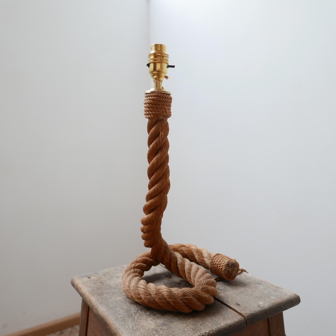 A scarce table lamp attributed to Audoux Minet.

France, circa 1960s.

Rope cord.

Re-wired and PAT tested.

Dimensions: 19 W x 21 D x 41 H in cm.