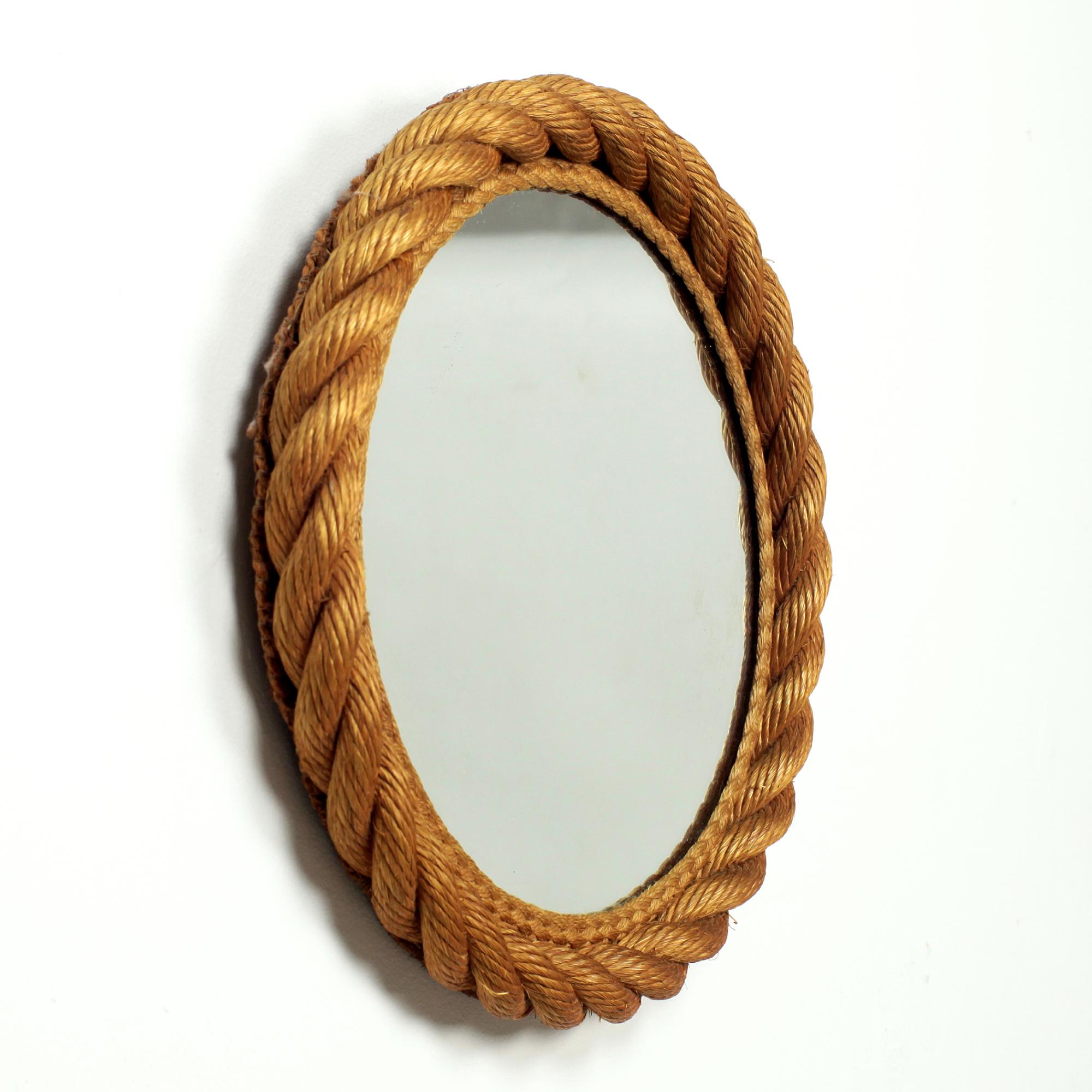 A beautiful wall mirror designed by Audoux Minet in Golfe-Juan on the French Riviera in the 1960s.
Hand crafted rope round frame
This iconic Audoux Minet rope design mirror is in excellent original condition, with a great patina.

