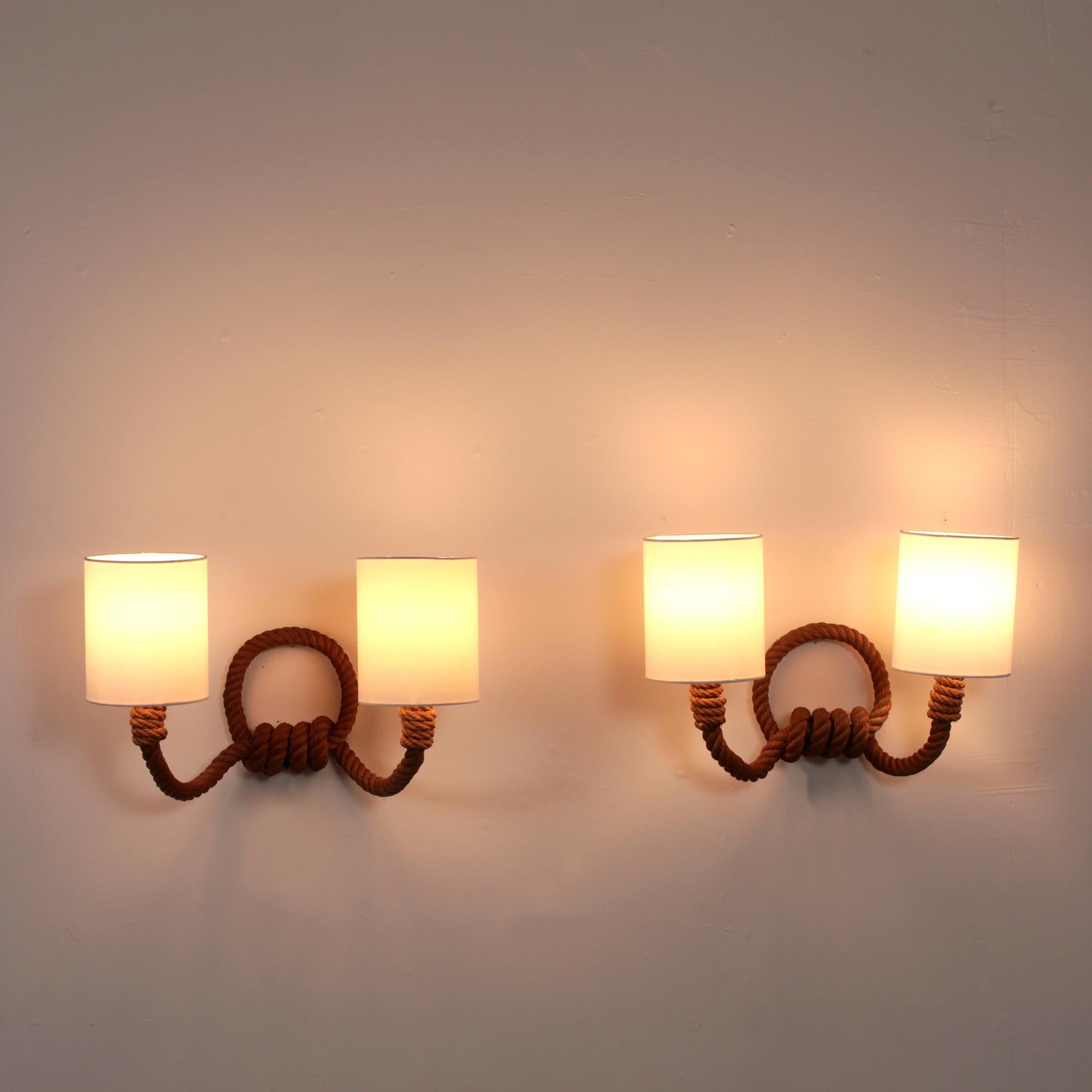 Nice original Adrien Audoux and Frida Minet pair of rope wall sconces, France, 1950.
2 lights per wall lamp
Original B22 socket with switch on each
Dimensions with Lampshade:
Depth 18 cm - Width 40 cm - Height 37 cm
Good original vintage condition.