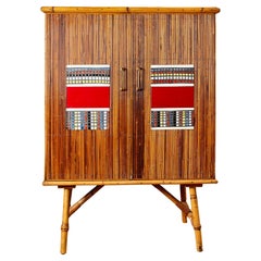 Audoux Minet rattan buffet, Roger Capron ceramic, circa 1960, France.