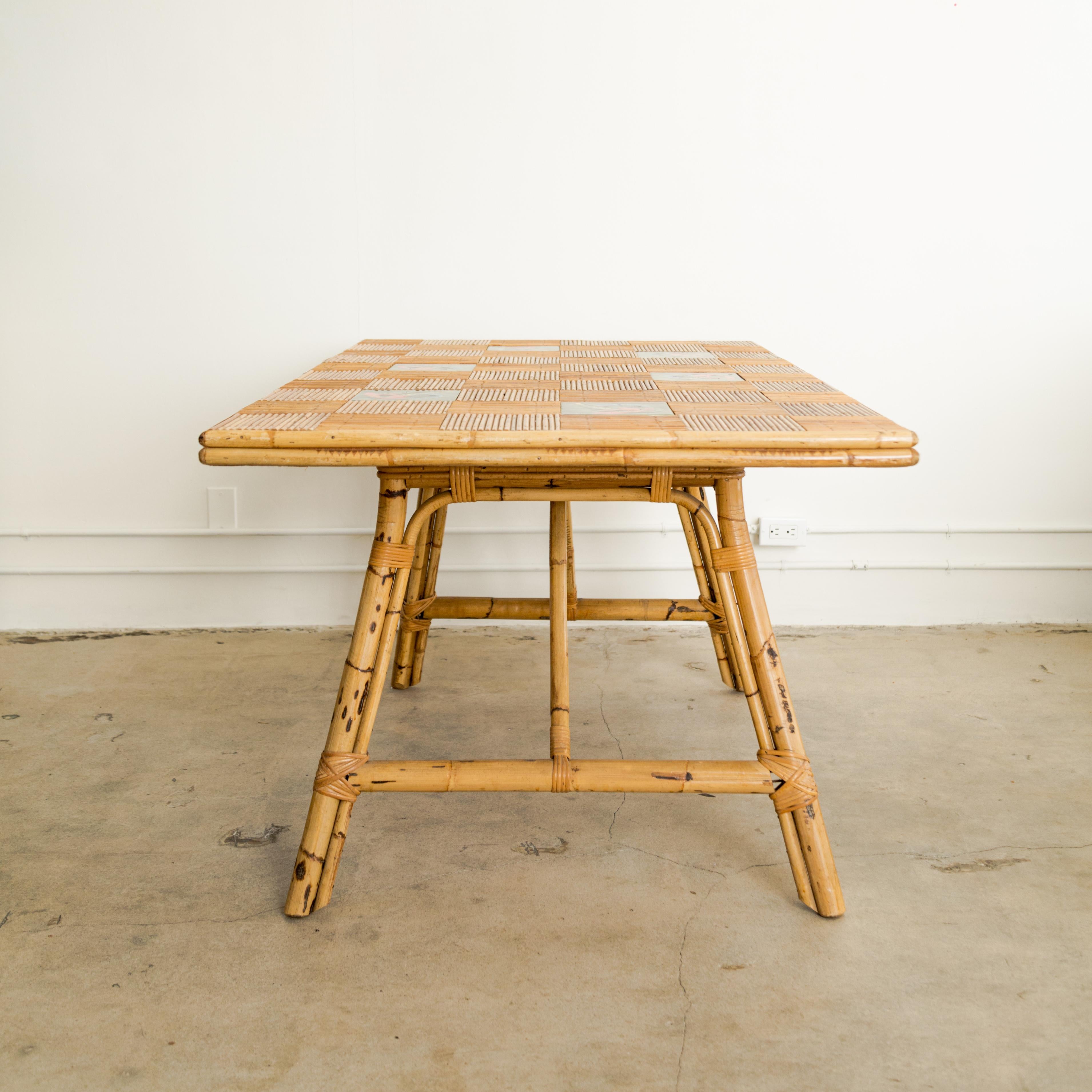 Dining table with quarter turned split bamboo top with Roger Capron inset glazed floral tiles, table designed by Audoux Minet, France circa 1950's.