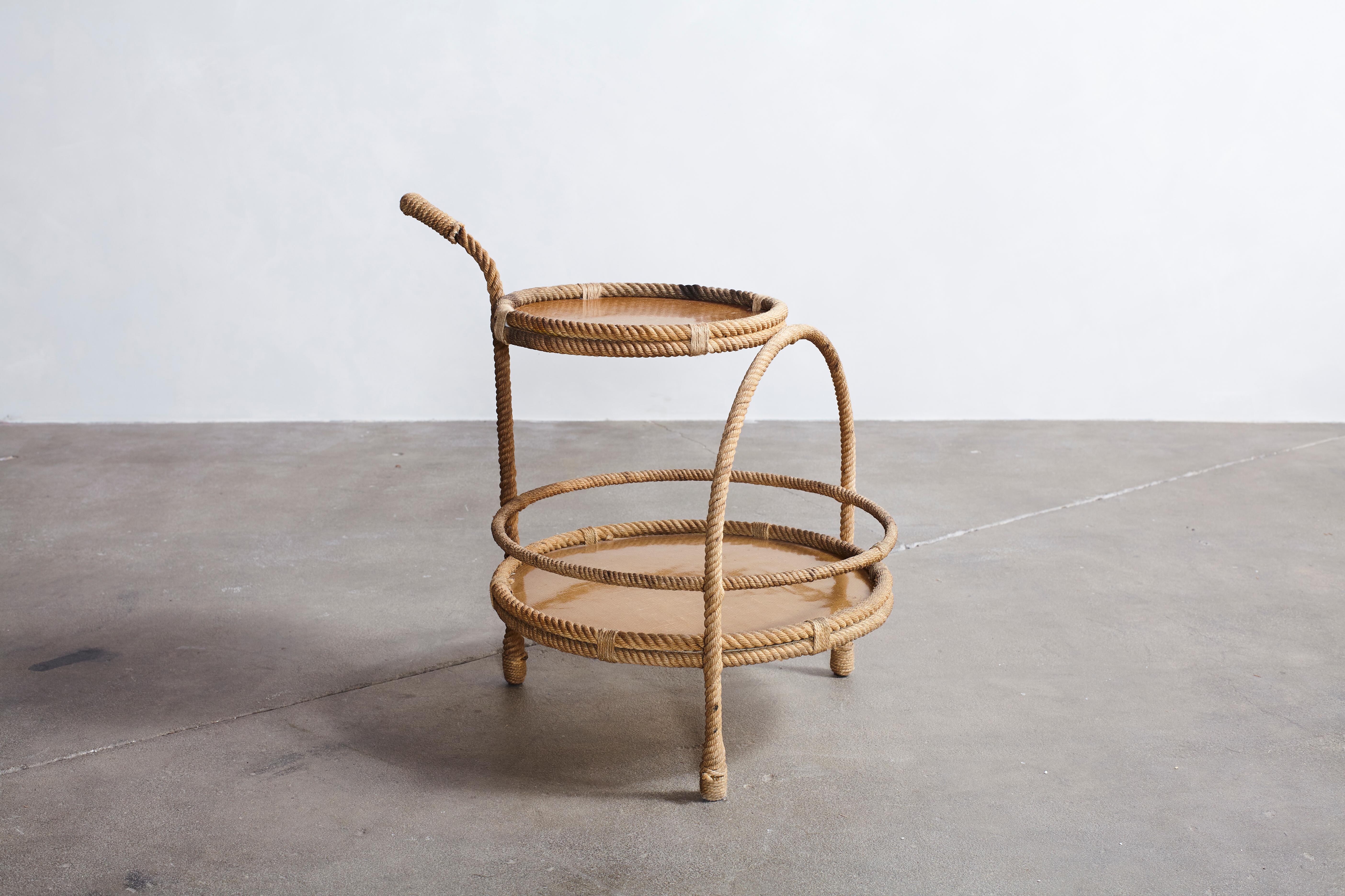 Audoux-Minet rope and fiber glass side table.
Exceptional table by Adrien Audoux & Frida Minet, manufactured by Vibo in France in the 1950s. Frame is made of rope with two fiberglass trays.