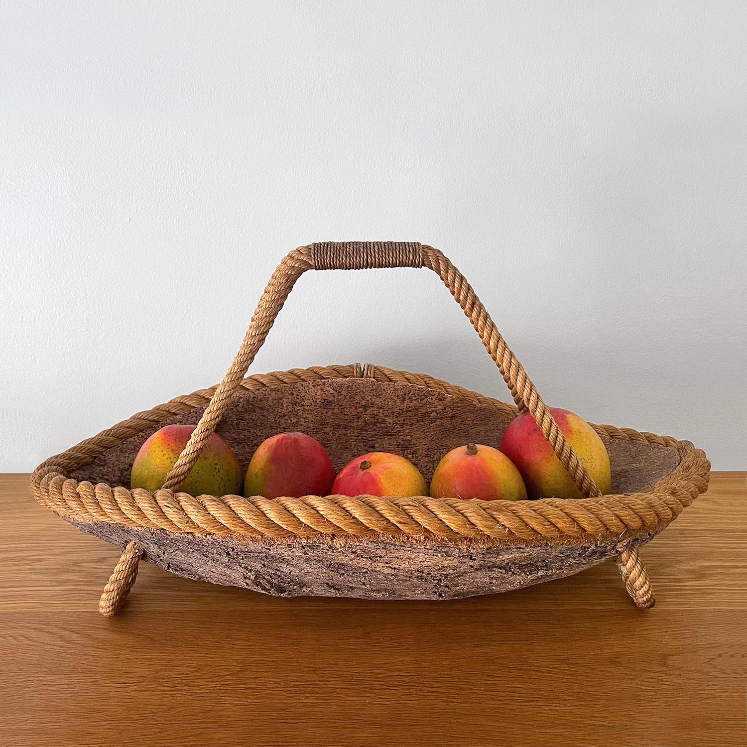 Adrien Audoux & Frida Minet catch all, basket 
France, circa 1950’s
Rustic cork and signature rope detail legs, trim and handle
Lovely patina throughout
Rare piece.