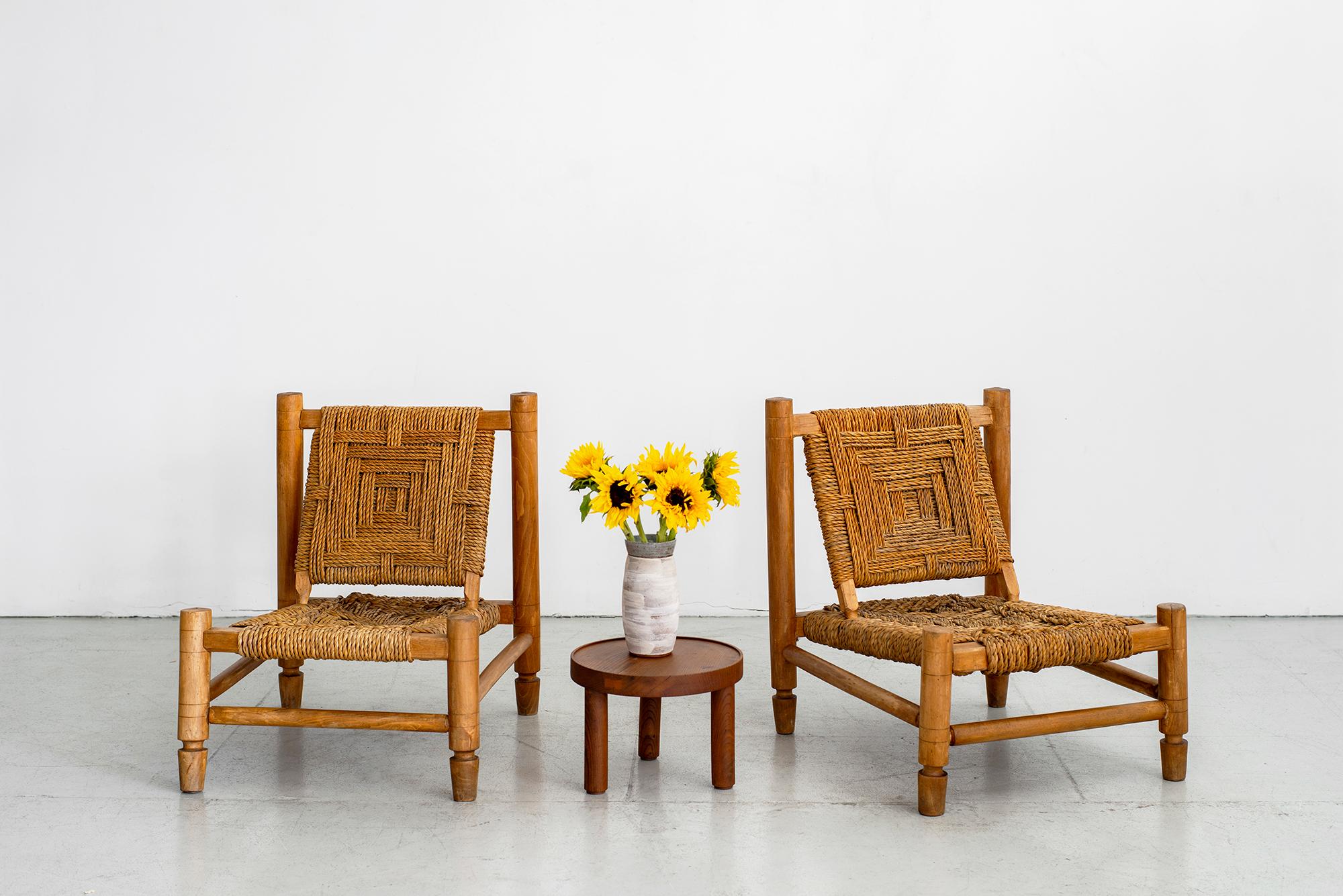 Pair of Adrien Audoux and Frida Minet low lounge chairs. Made of stained beech and abaca rope with beautiful woven design. Nice age and patina throughout.

 