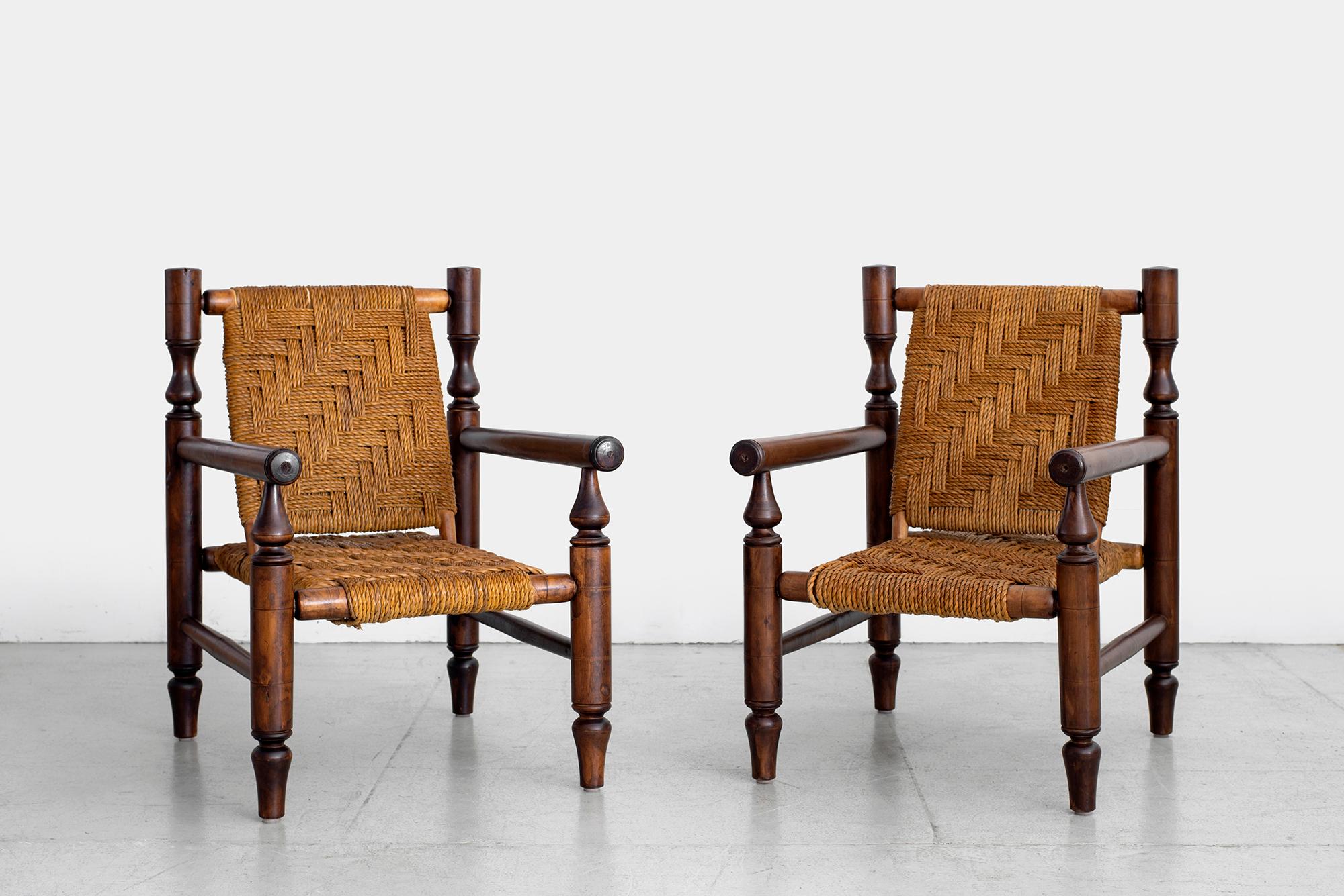 Wonderful pair of armchairs by Adrien Audoux and Frida Minet. 
Made in France, circa 1950s. 
Fantastic patina to wood 
Beechwood and abaca rope.