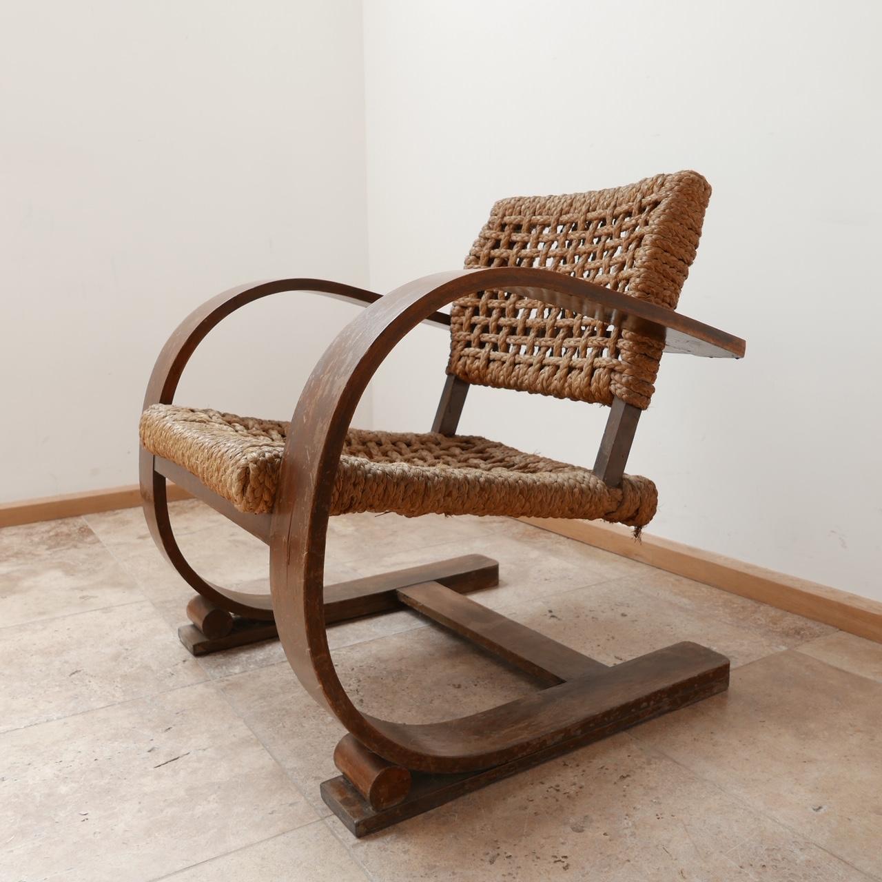 A bentwood and rope armchair by French design legends Audoux-Minet. 

France, c1960s. 

A scarce model increasingly hard to find and very sought after. 

The woodwork has wear which our restorer can review. 

The rope is in relatively good