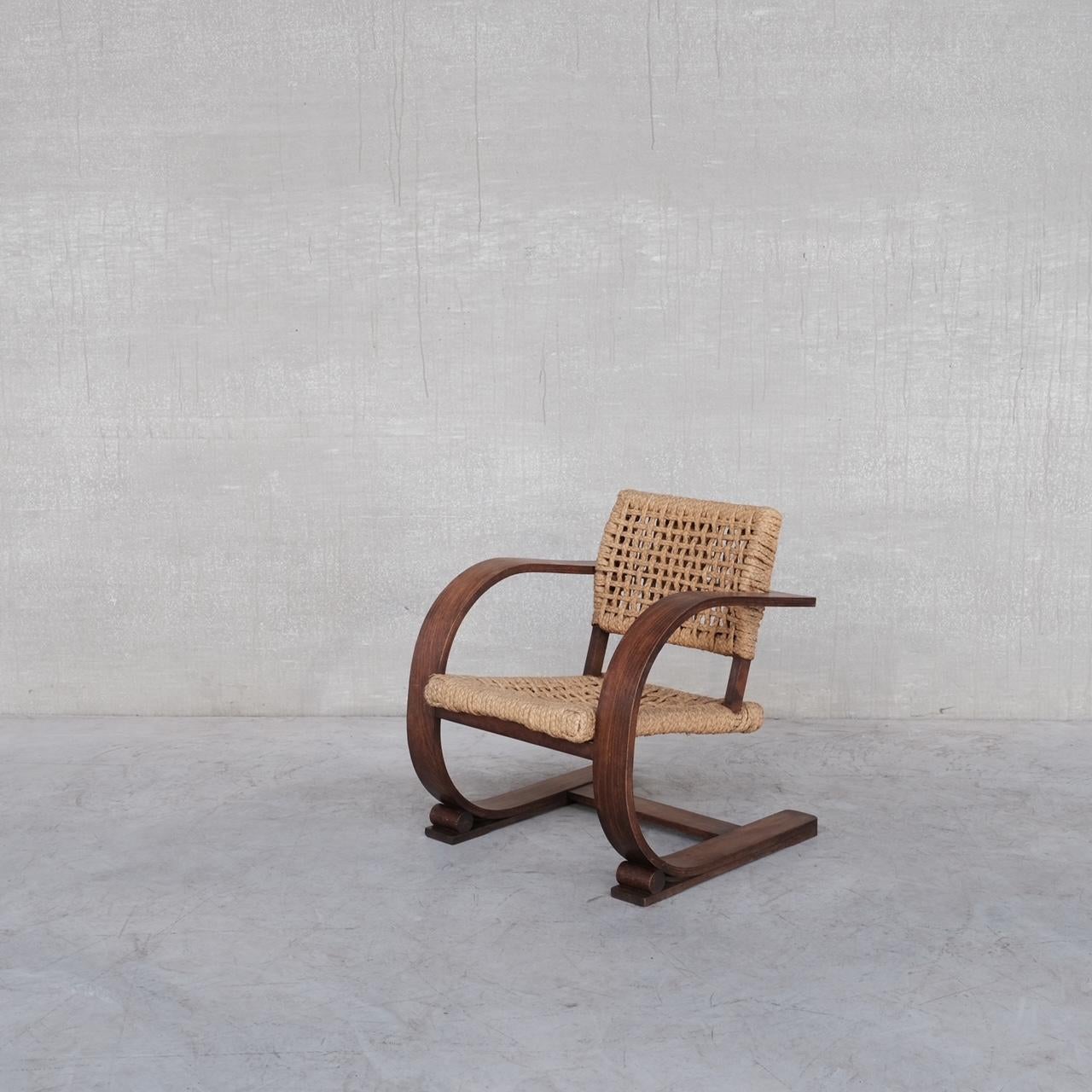 A bentwood and rope armchair by French design legends Audoux-Minet. 

France, c1960s. 

A scarce model increasingly hard to find and very sought after. 

The rope work remains in good condition.

Location: London Gallery. 

Dimensions: 86