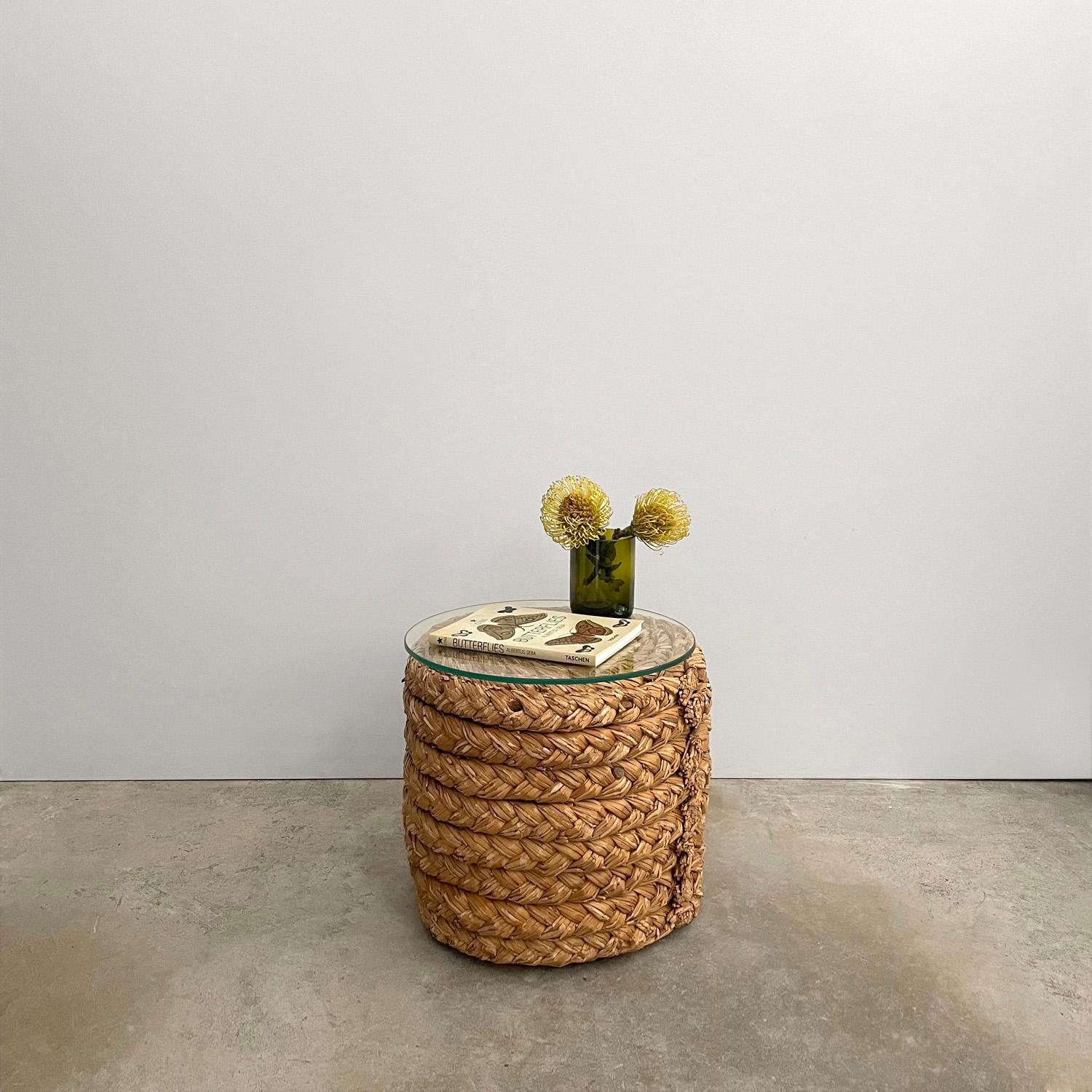 Adrien Audoux & Frida Minet rope side table
France, circa 1950s
Braided seagrass is carefully coiled around a heavyweight base
Secured with aged wooden pegs and finished with metal banding on the ends
Patina from age and use
We have made a new glass