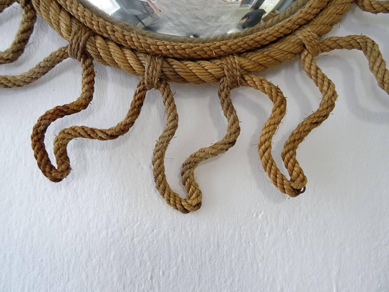 Rare sunburst rope convex mirror made by Adrien Audoux and Frida Minet. Free priority UPS shipping from Italy with no custom fees.