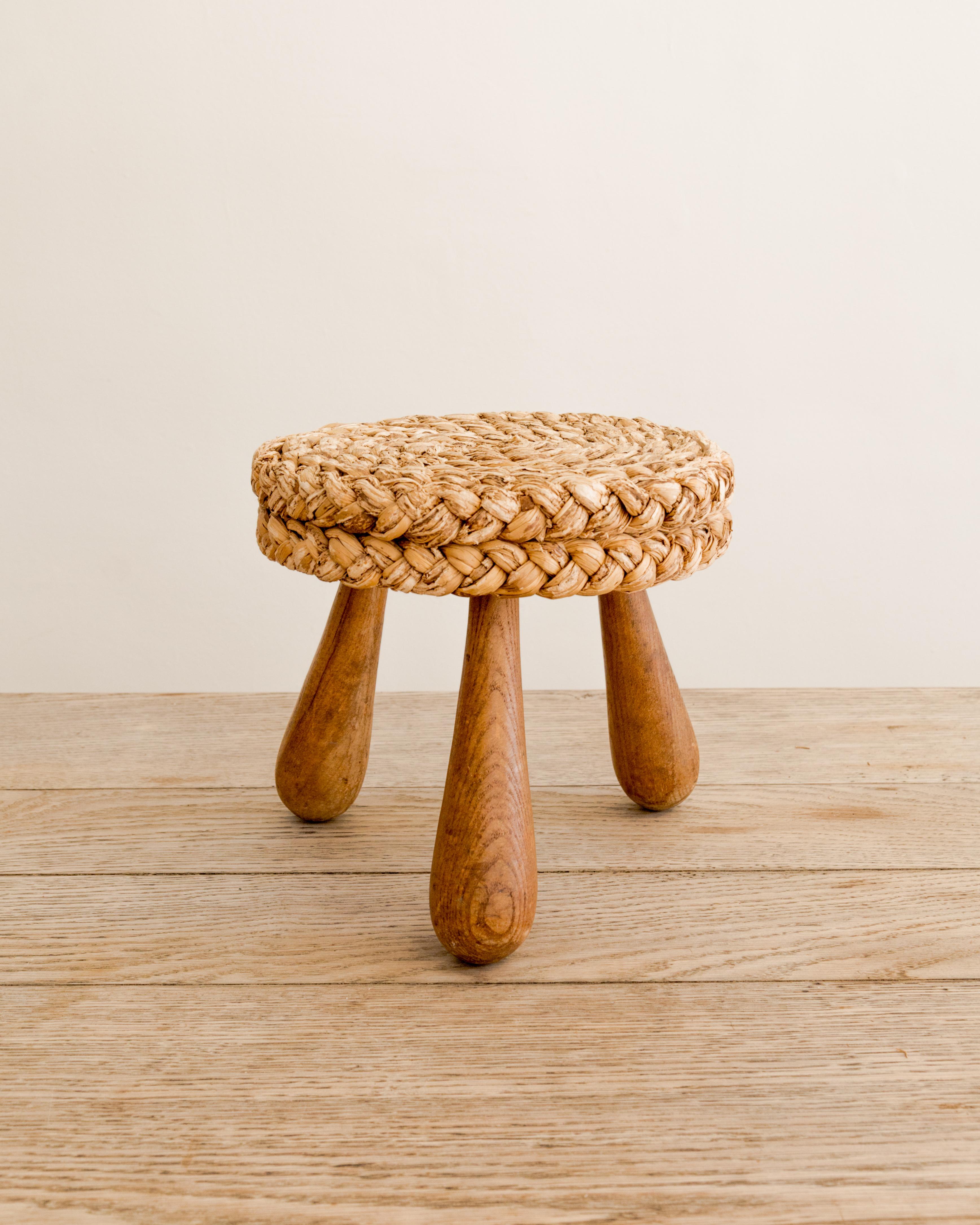 Three-legged, braided rush seat tabouret by Audoux-Minet, France circa 1950's.