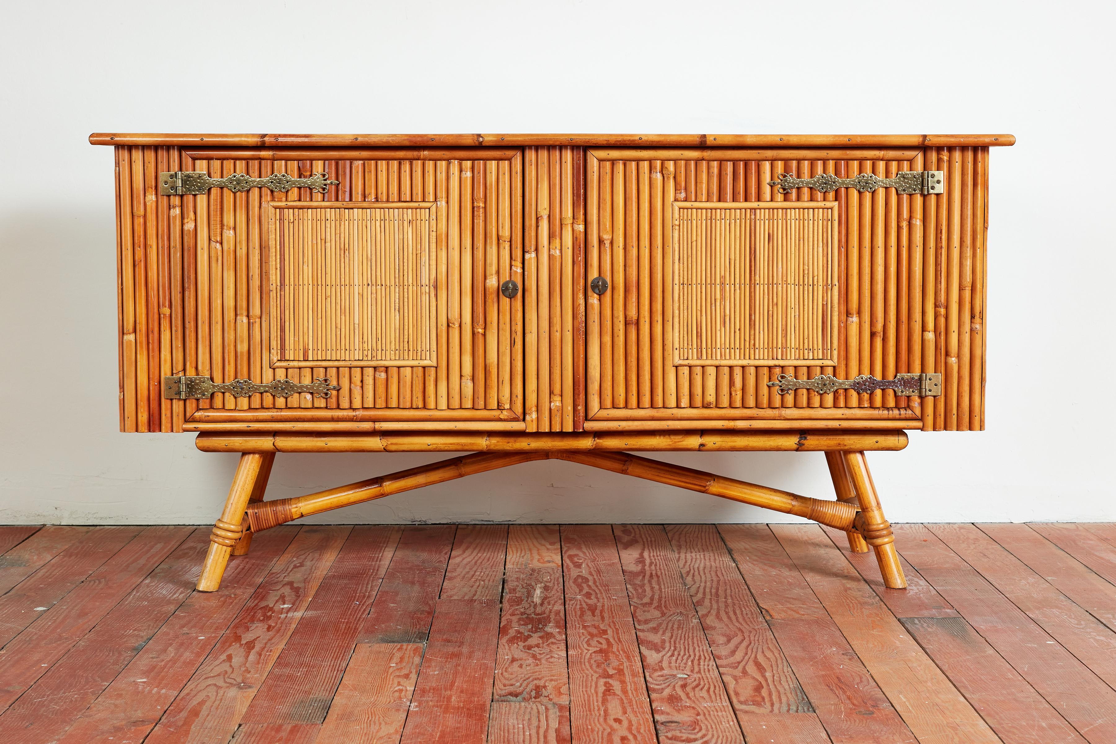 Audoux Minet bamboo sideboard with ornate brass hinges and hardware, oak wood top and open shelving interiors for storage.