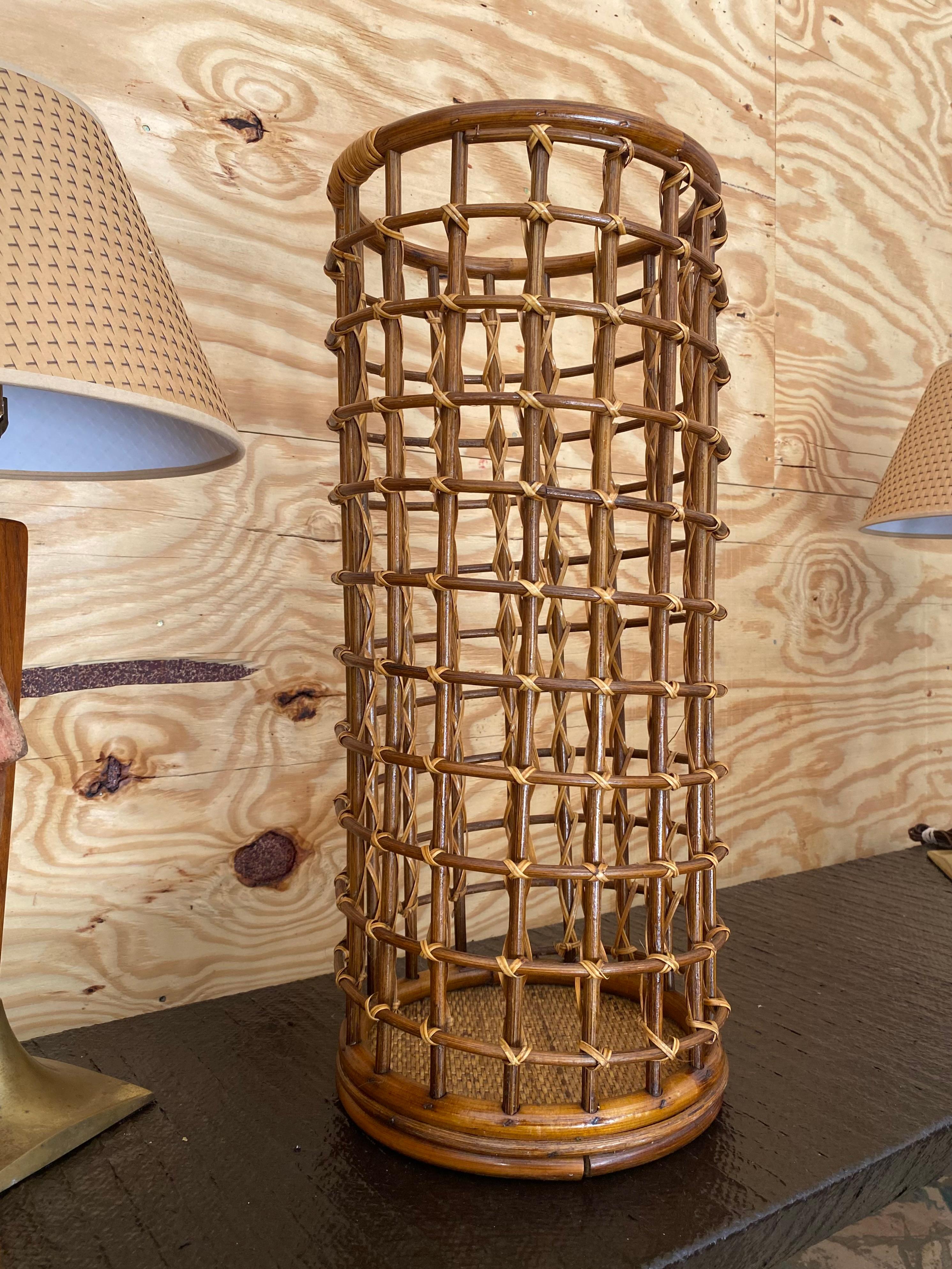Handwoven umbrella stand in rattan in the style of Louis Sognot. Large size, tall piece in excellent original condition. A wonderful example of midcentury artisanal work, where bamboo and rattan are perfectly blended and shaped.

Louis Sognot