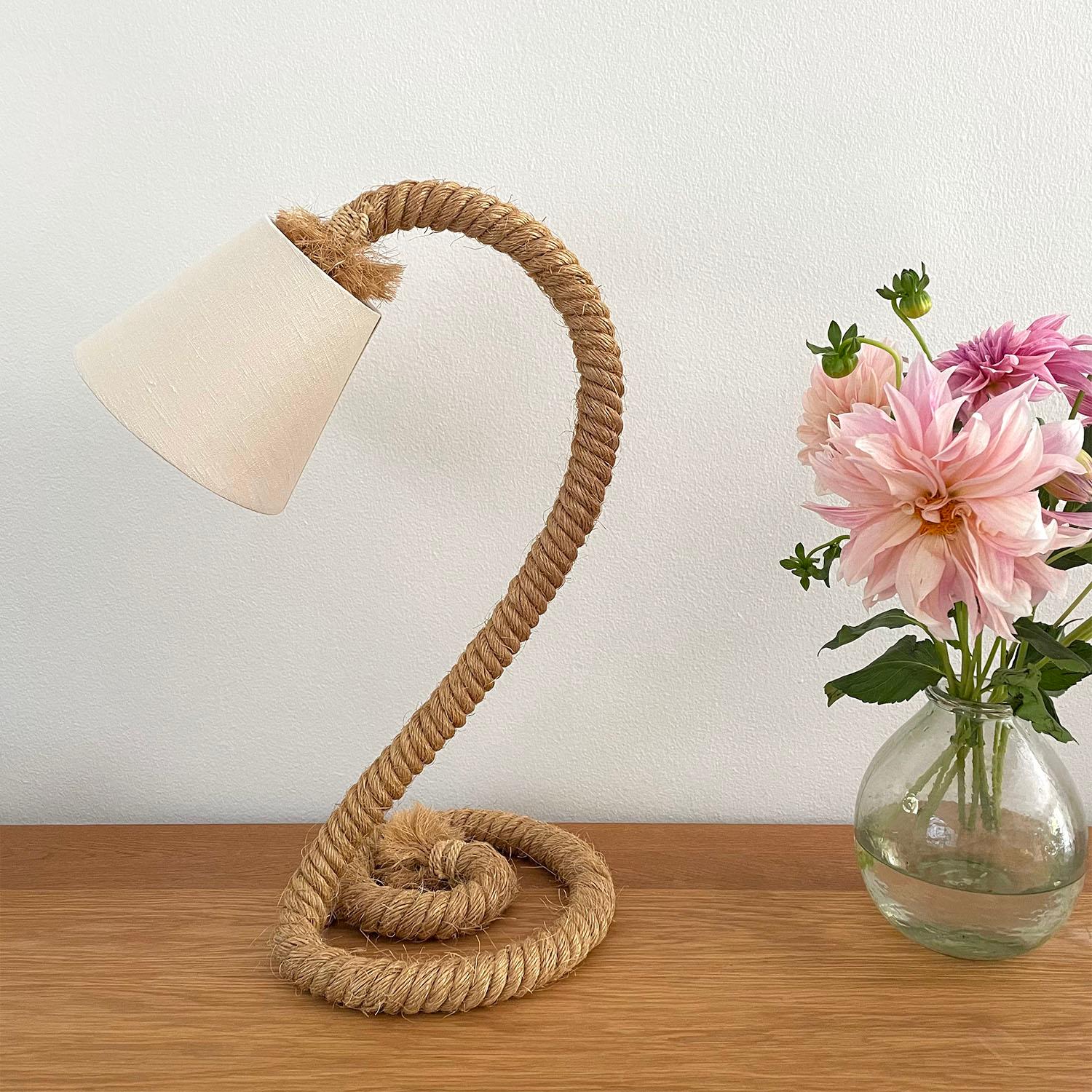 Adrien Audoux and Frida Minet table lamp
France, circa 1950’s
Sculpted twisted rope with unique spiral base 
Beautiful design
New linen shade
Newly rewired
Single socket medium base
Flat fabric cord
Roller switch
Additional Audoux Minet pieces