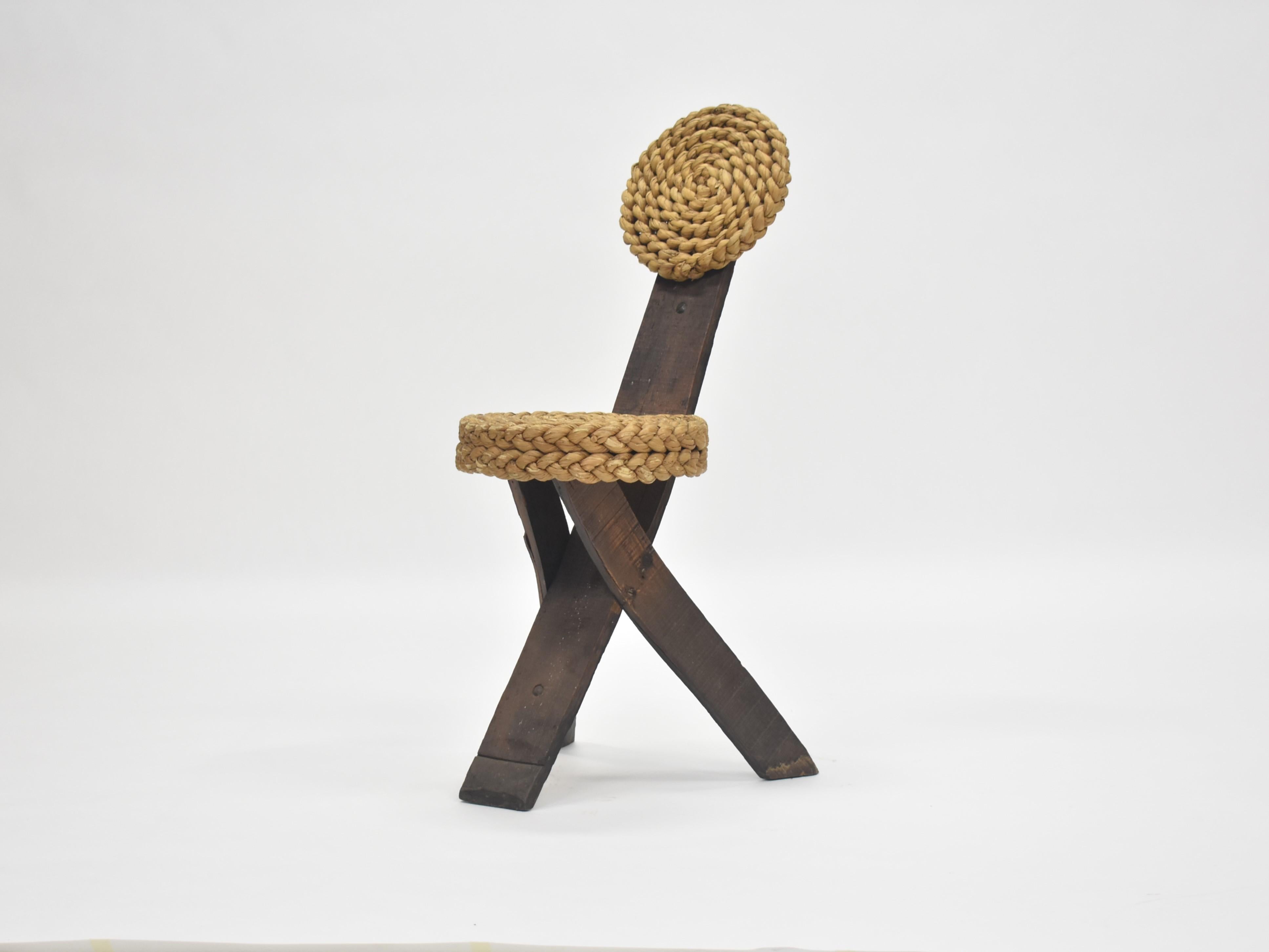 A rope and wood chair by Frida Minet and Adrien Audoux, circa 1950s, France. The modernist design has a simple frame clad in woven abaca. This special piece is in great condition, though has some wear that is consistent with its age. 
