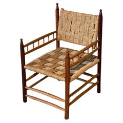 Audoux Minet Sessel aus gedrechseltem Holz und Seil 1950