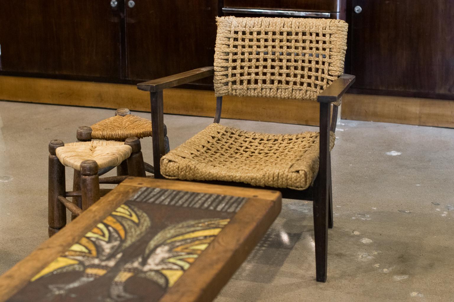 Wood framed armchair with seat and back of woven hemp rope from the abaca plant. These highly collectible rope pieces are typical of Audoux-Minet for Vibo, which was long established in Marseille, France, 1940s.