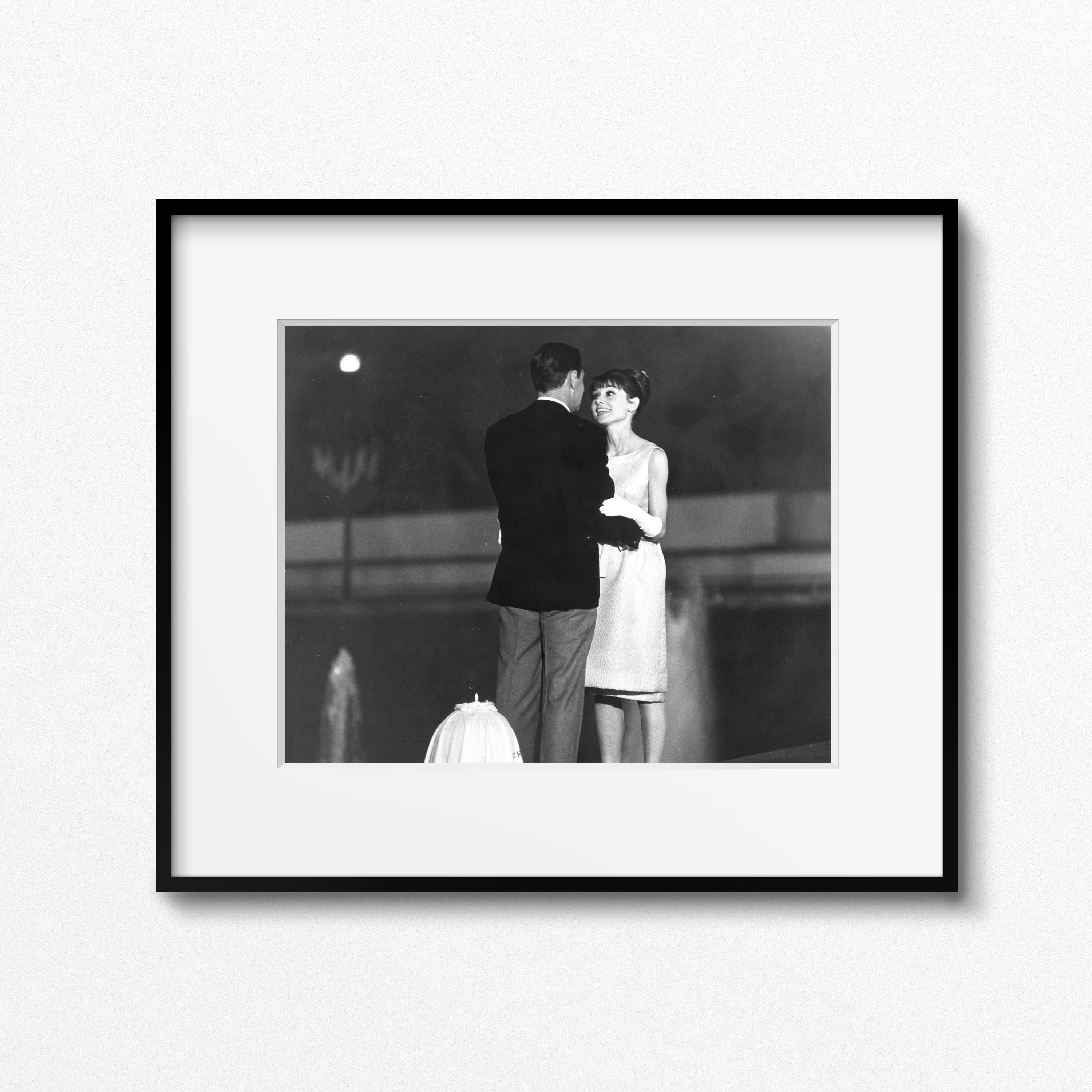 From the Personal collection of Audrey Hepburn

Audrey Hepburn and William Holden on the set of 'Paris When it Sizzles,' Paris, 1962 by Vincent Rossell
Vintage gelatin silver print
Photographer's credit stamp, Audrey Hepburn collection stamp and