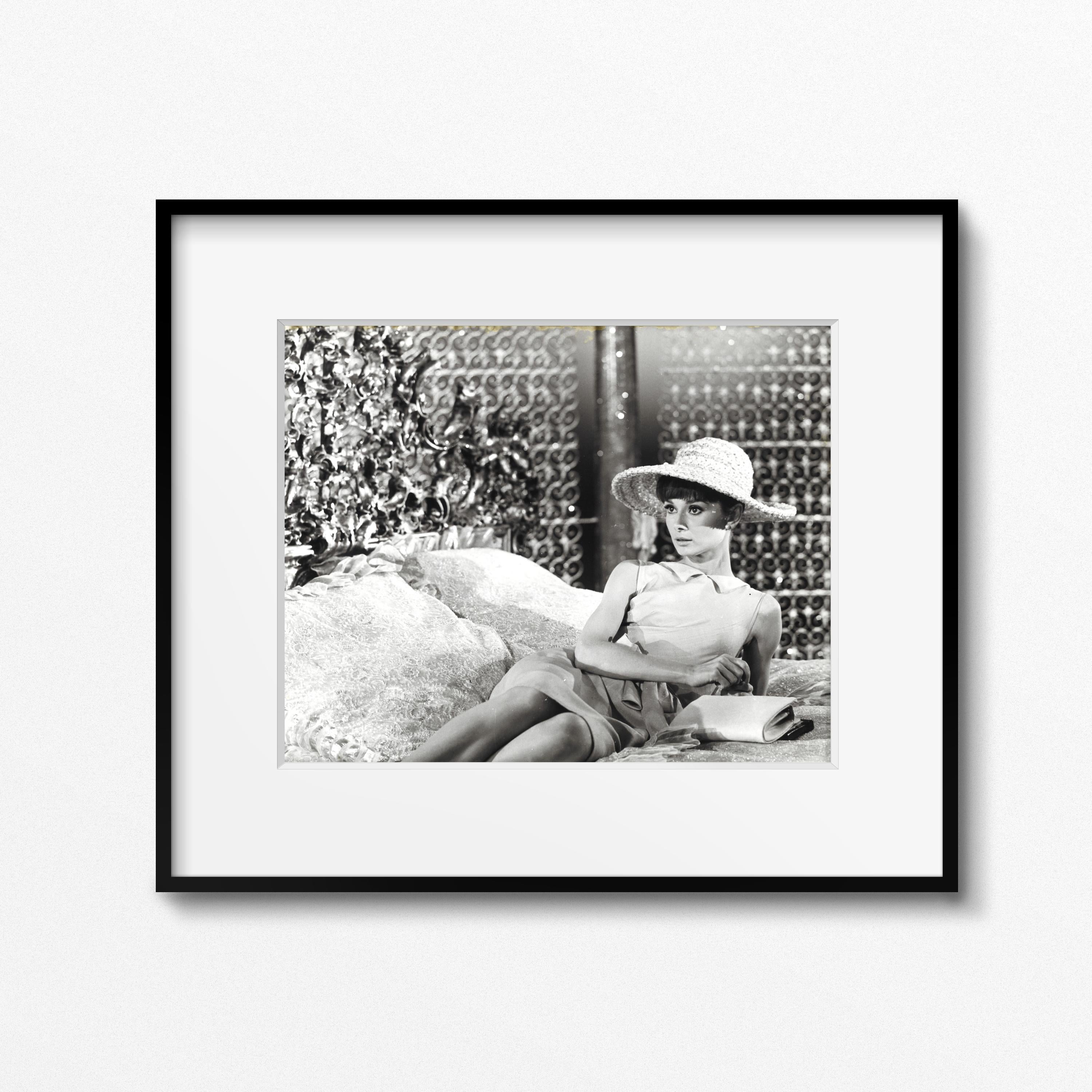 From the Personal collection of Audrey Hepburn

Audrey Hepburn on the set of 'Paris When it Sizzles,' Paris, 1962 by Vincent Rossell
Vintage gelatin silver print
Photographer's credit stamp, Audrey Hepburn collection stamp and numerical