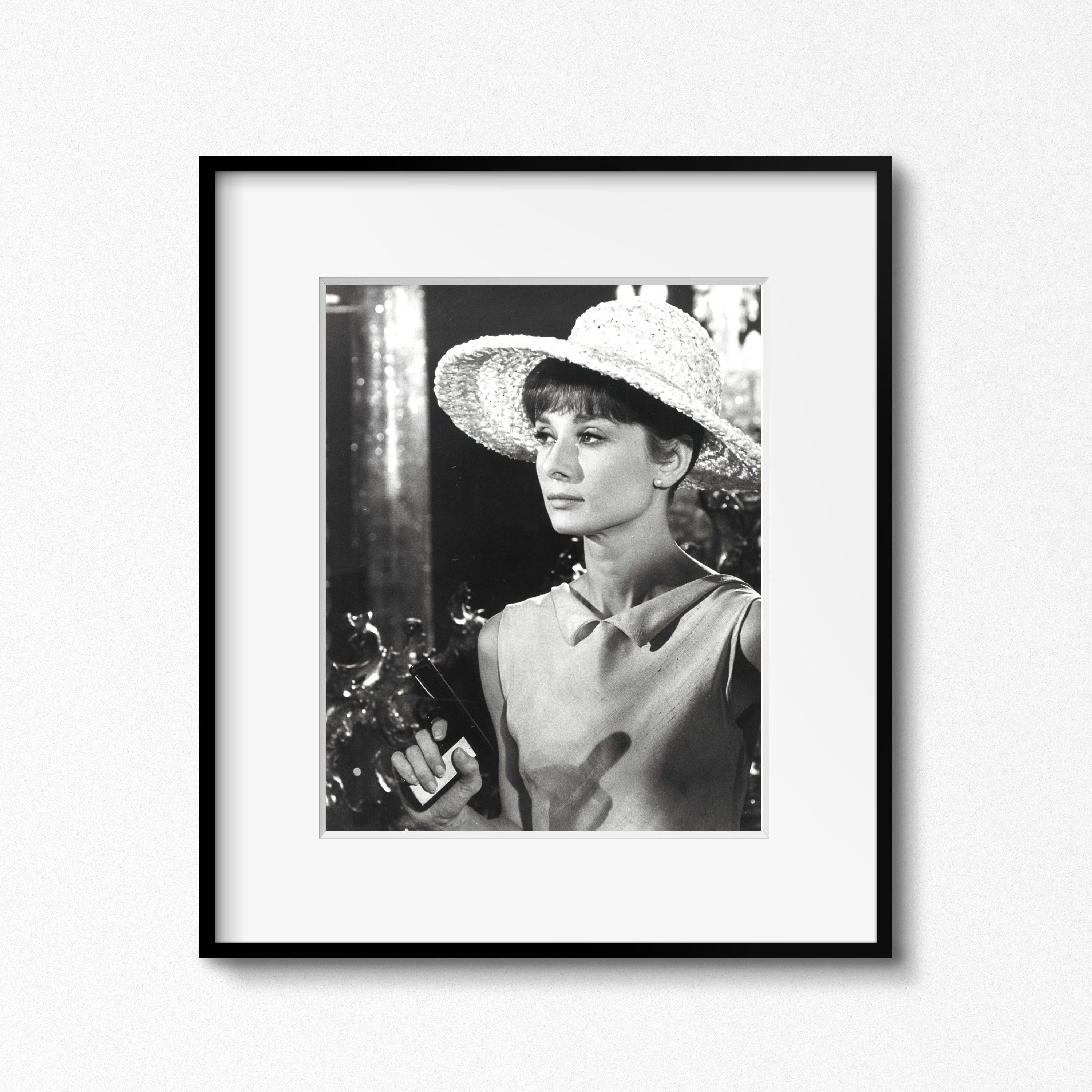 From the Personal collection of Audrey Hepburn

Audrey Hepburn on the set of 'Paris When it Sizzles,' Paris, 1962 by Vincent Rossell
Vintage gelatin silver print
Photographer's credit stamp, Audrey Hepburn collection stamp and numerical